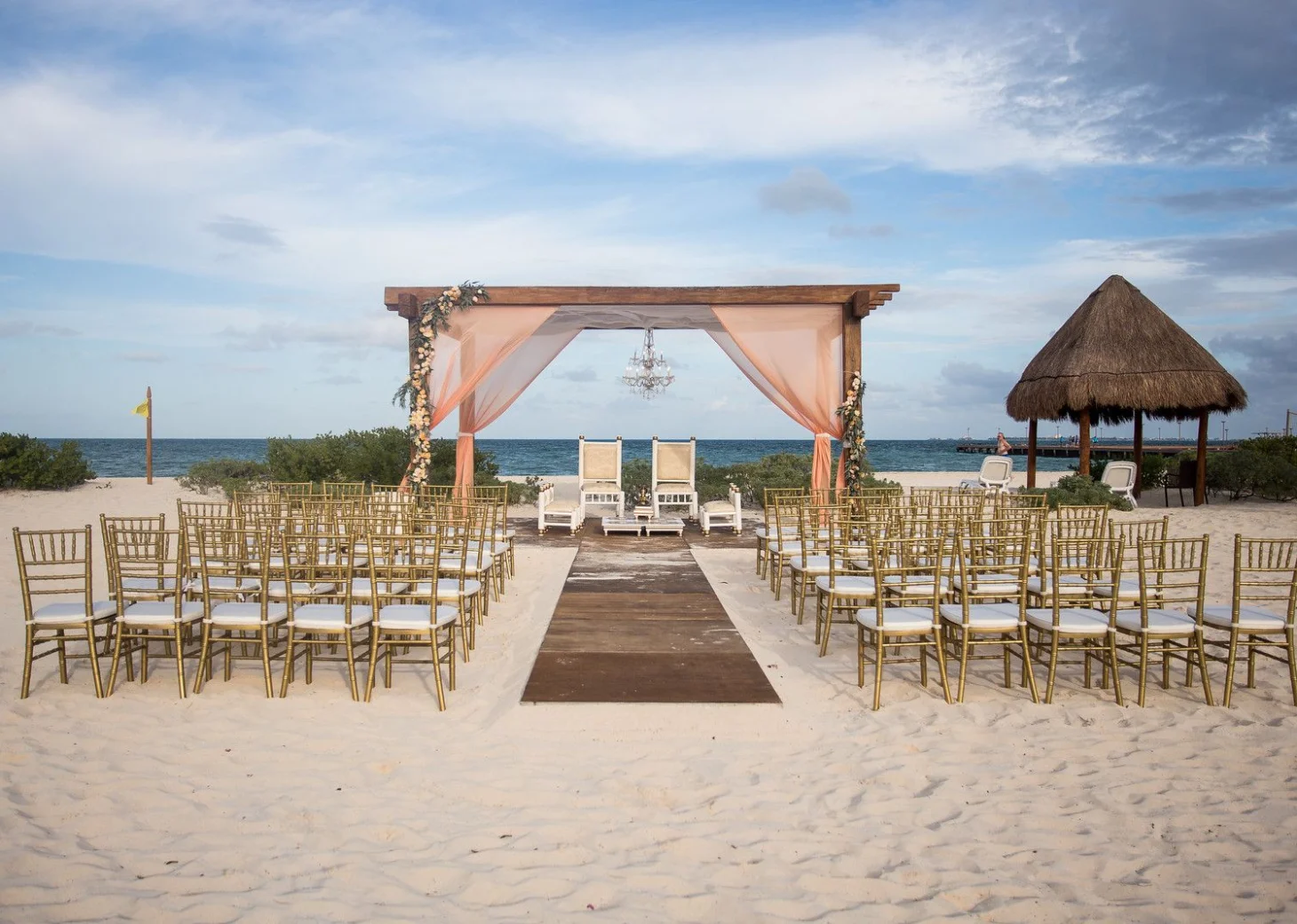 Beach wedding venue with altar at Dreams Playa Mujeres Golf and Spa