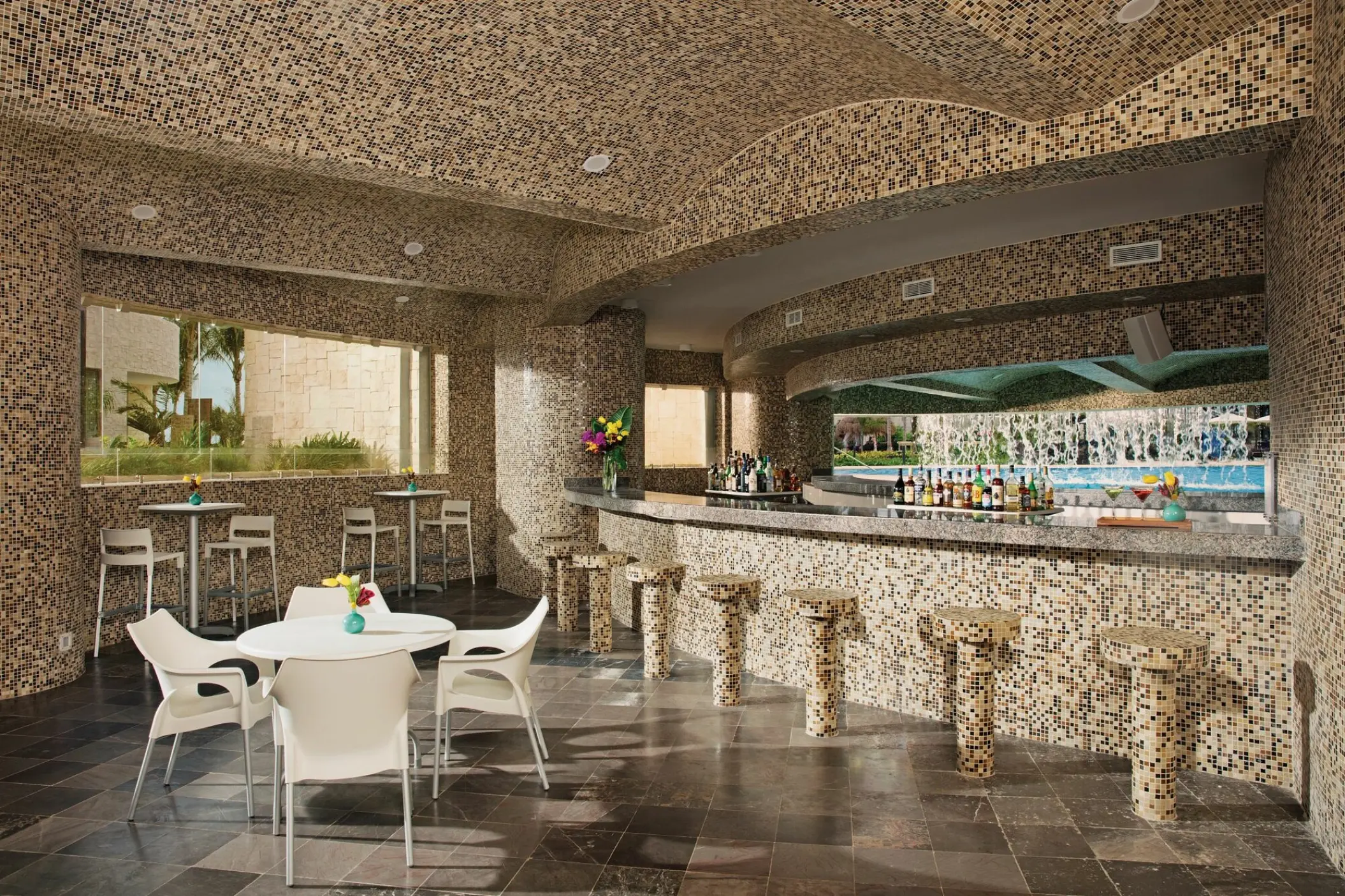 Dreams Playa Mujeres Grottos swim-up bar with mosaic tile decor and pool view, Cancun