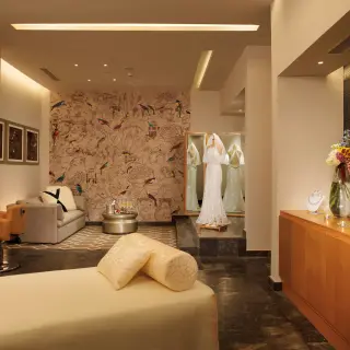 Bridal suite with wedding dress and vanity at Dreams Playa Mujeres, Cancun