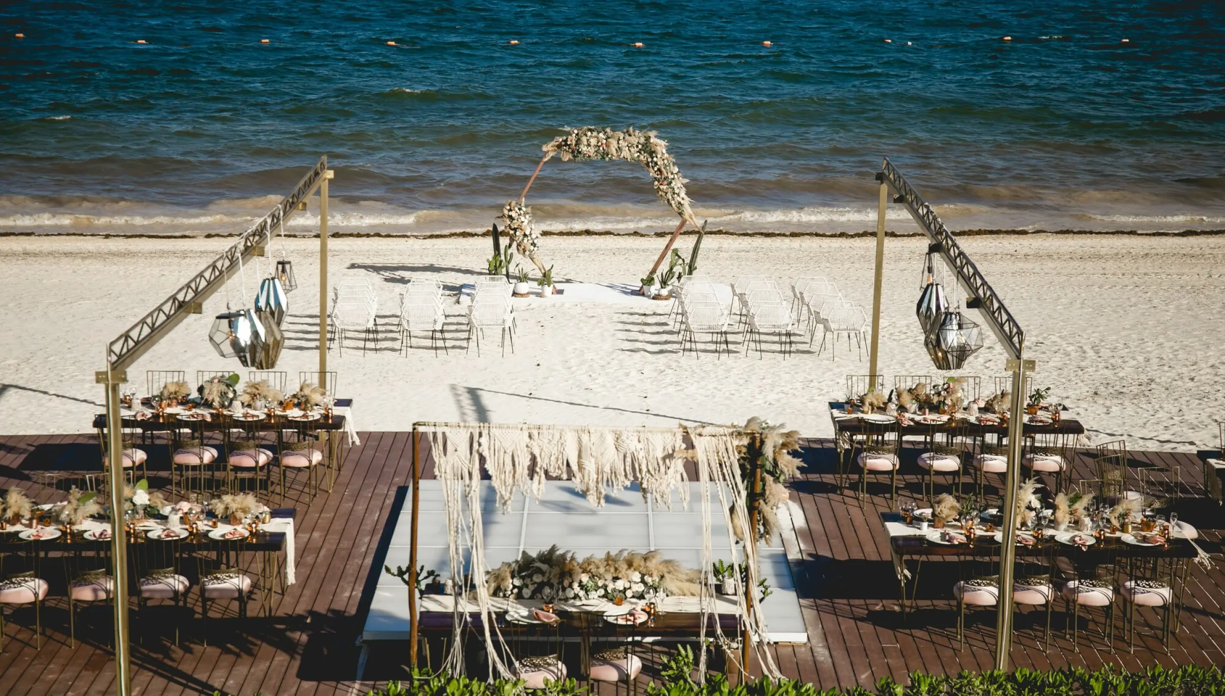 Beach wedding ceremony and reception setup at Dreams Riviera Cancun, Riviera Maya