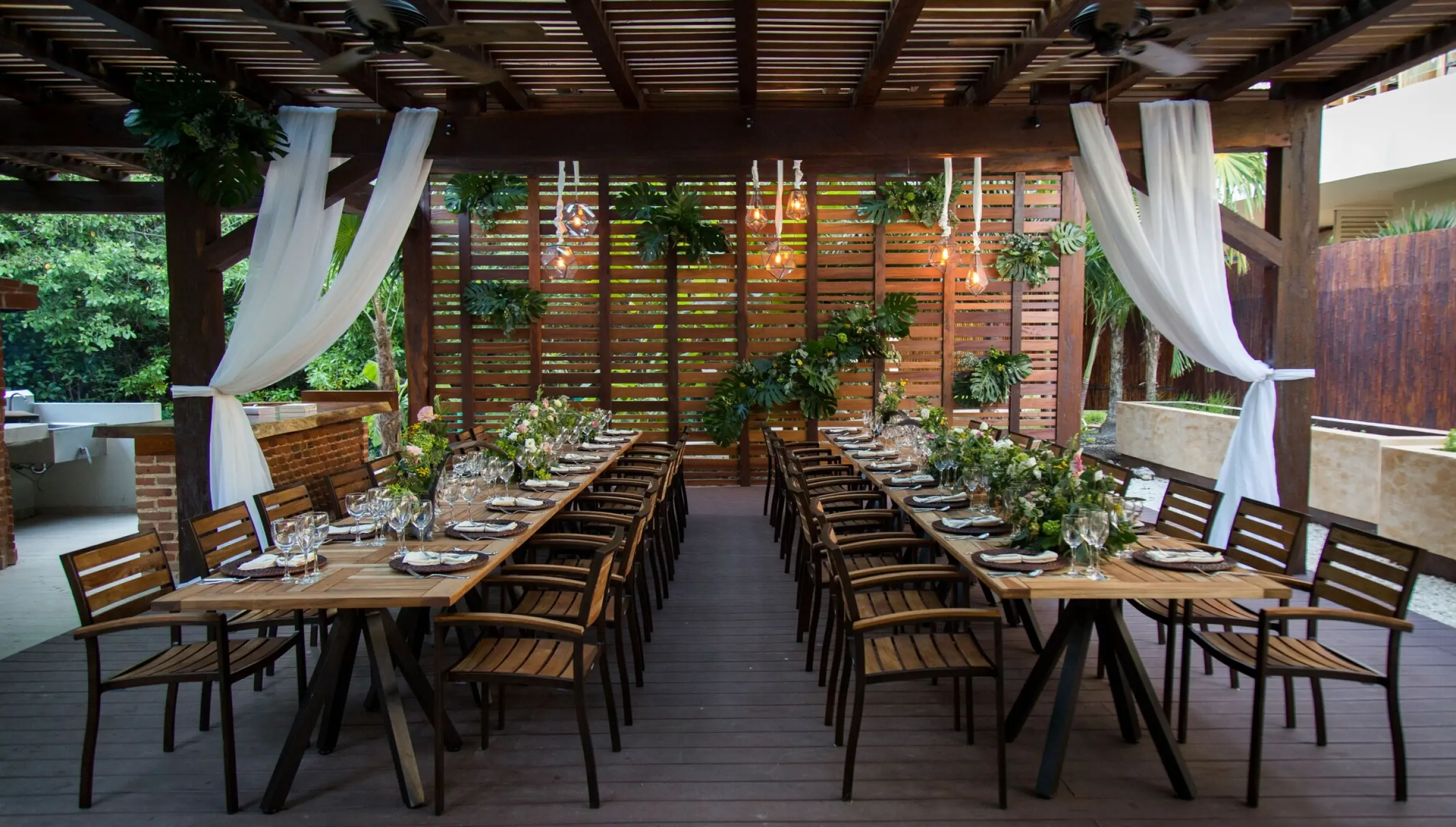 Outdoor wedding reception under a wooden pergola at Dreams Riviera Cancun, Riviera Maya