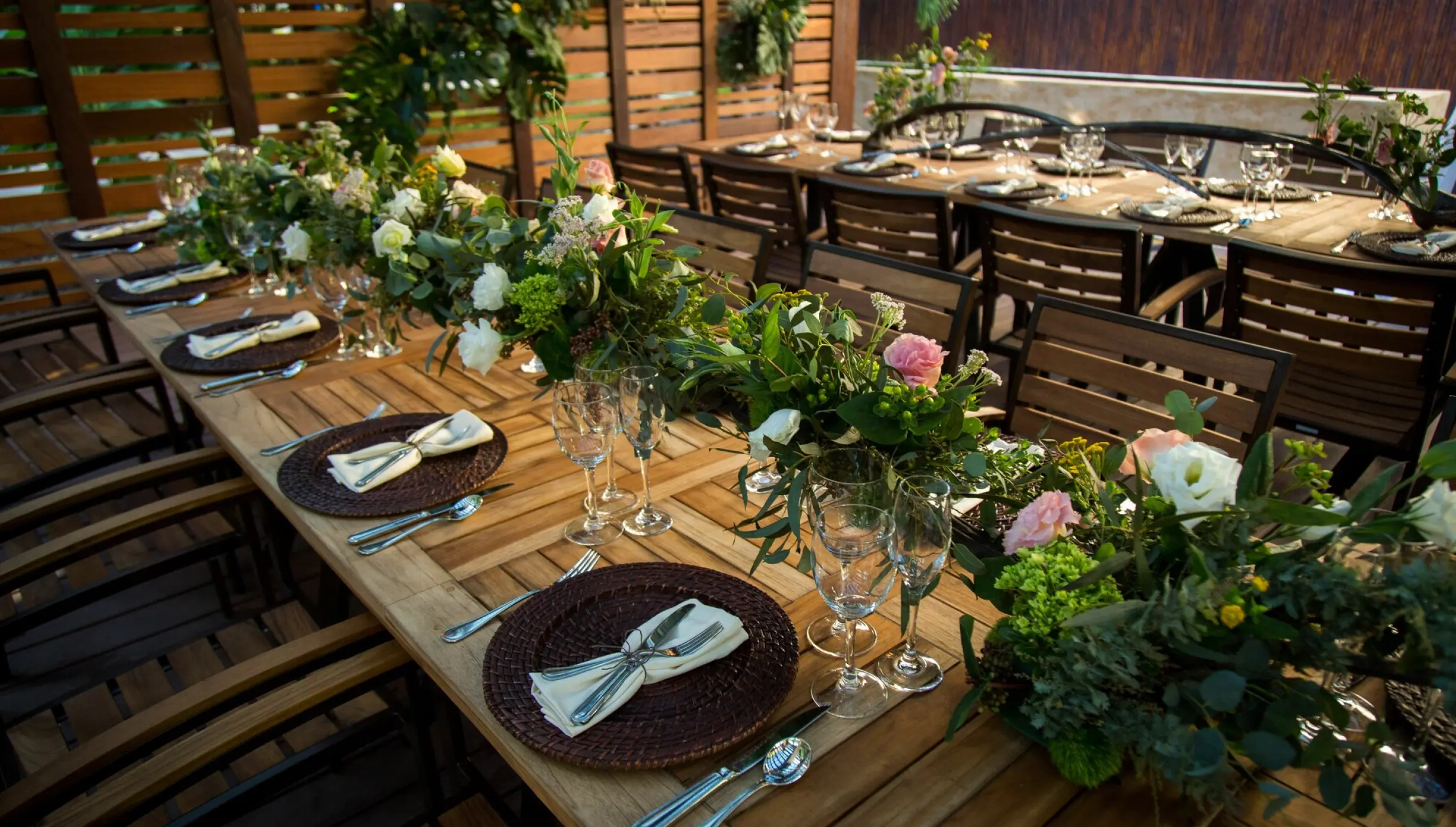 Long wooden tables set for a wedding reception at Dreams Riviera Cancun, Riviera Maya