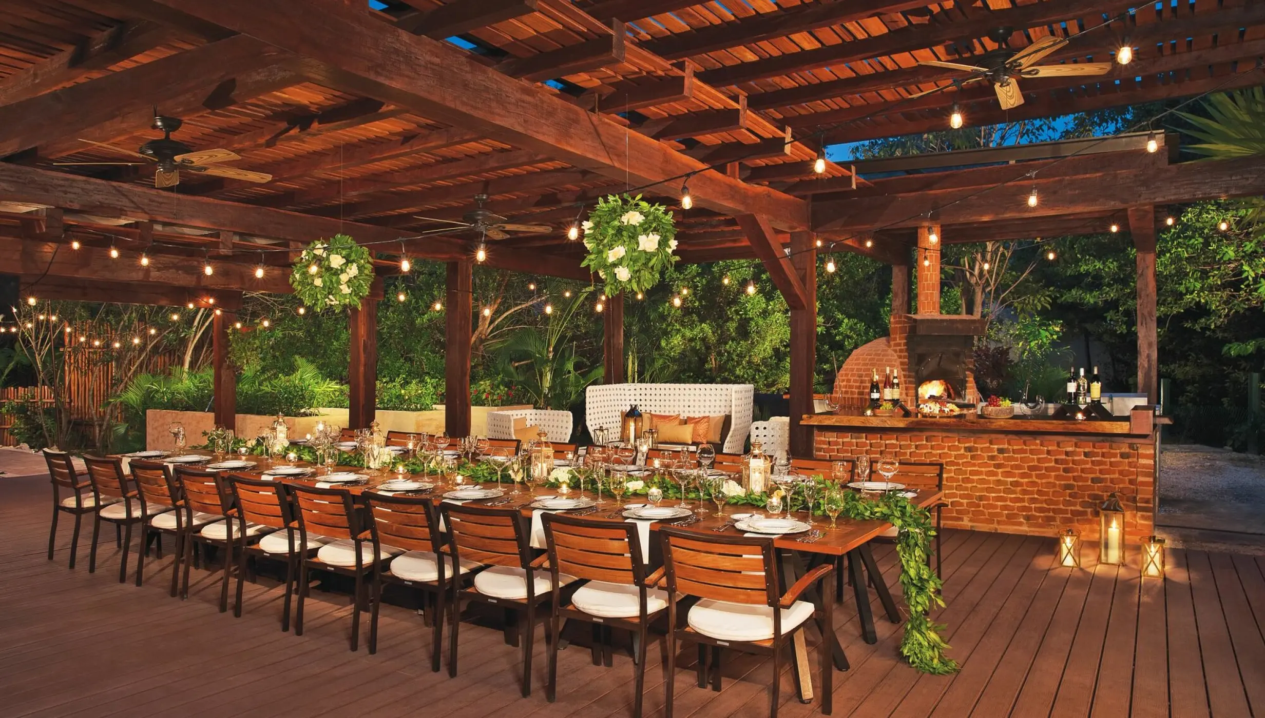 Long wooden banquet table for a wedding reception at Dreams Riviera Cancun, Riviera Maya