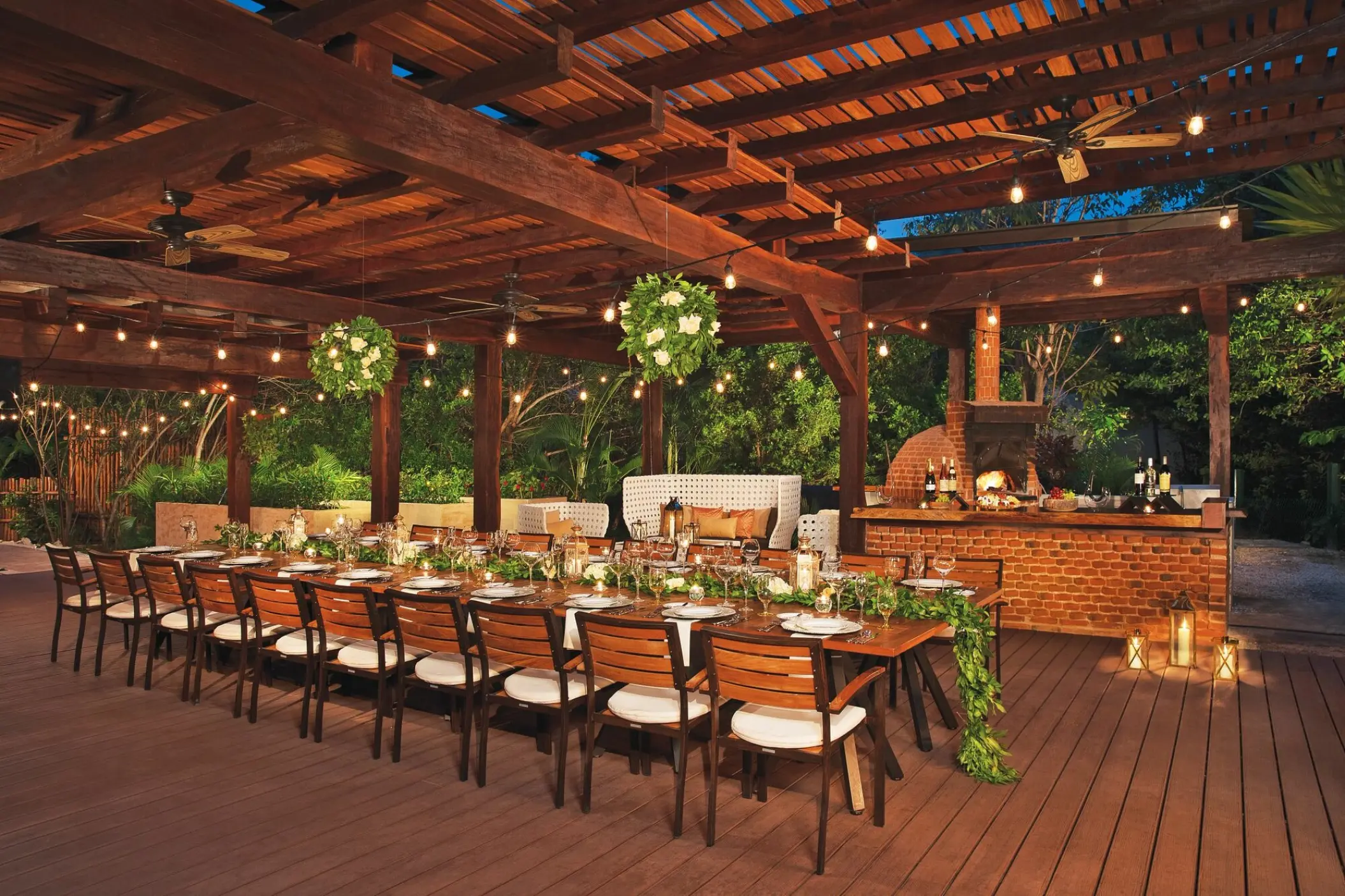 Long wooden banquet table for a wedding reception at Dreams Riviera Cancun, Riviera Maya