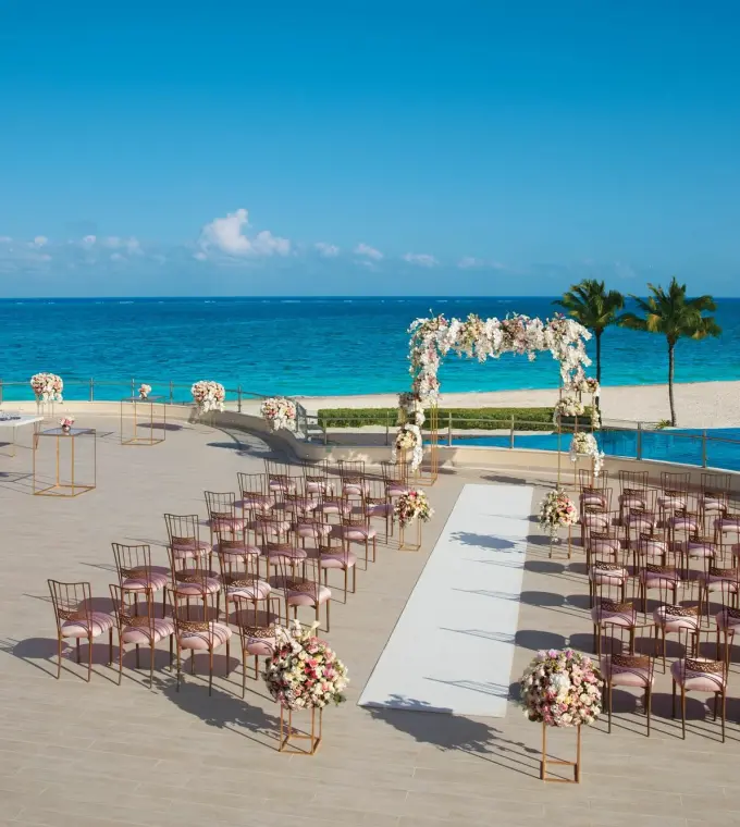Oceanfront terrace wedding ceremony setup at Dreams Riviera Cancun, Riviera Maya