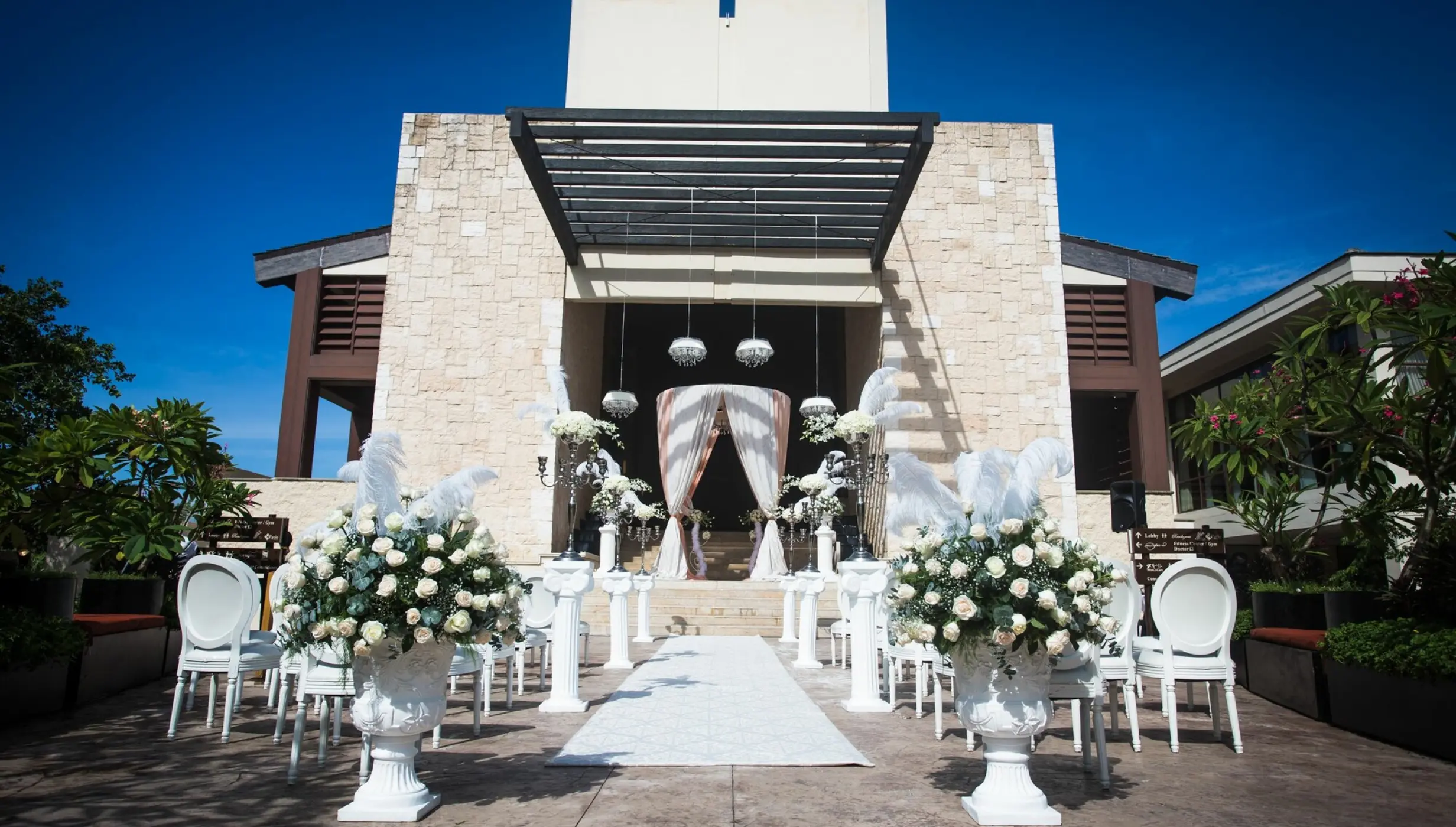 Lobby staircase wedding ceremony setup at Dreams Riviera Cancun, Riviera Maya