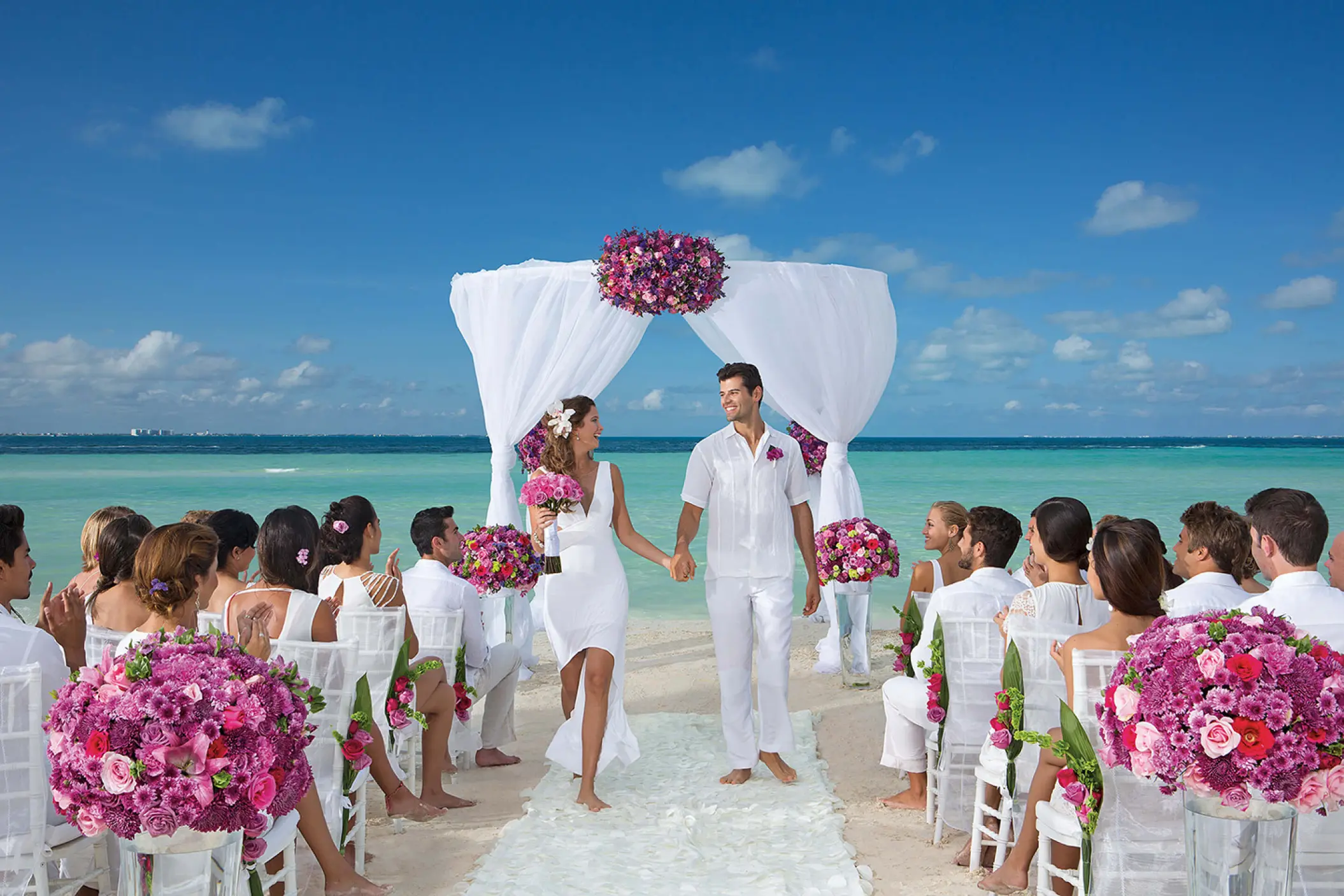 Beachfront wedding ceremony on the sand at Dreams Sands Cancun, Cancun