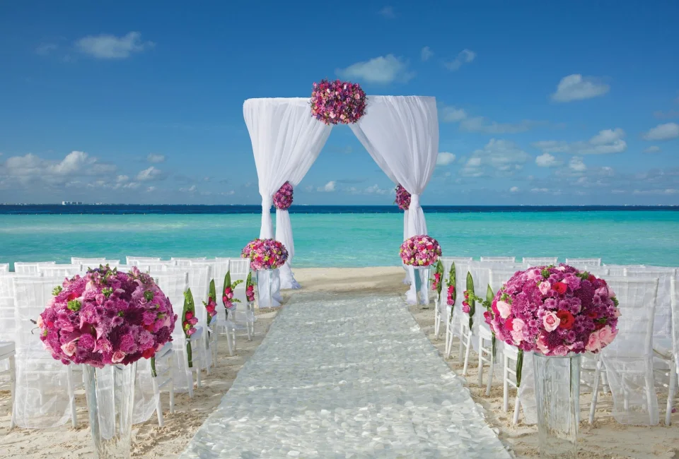 Dreams Sands Cancun beach wedding venue with chair and altar