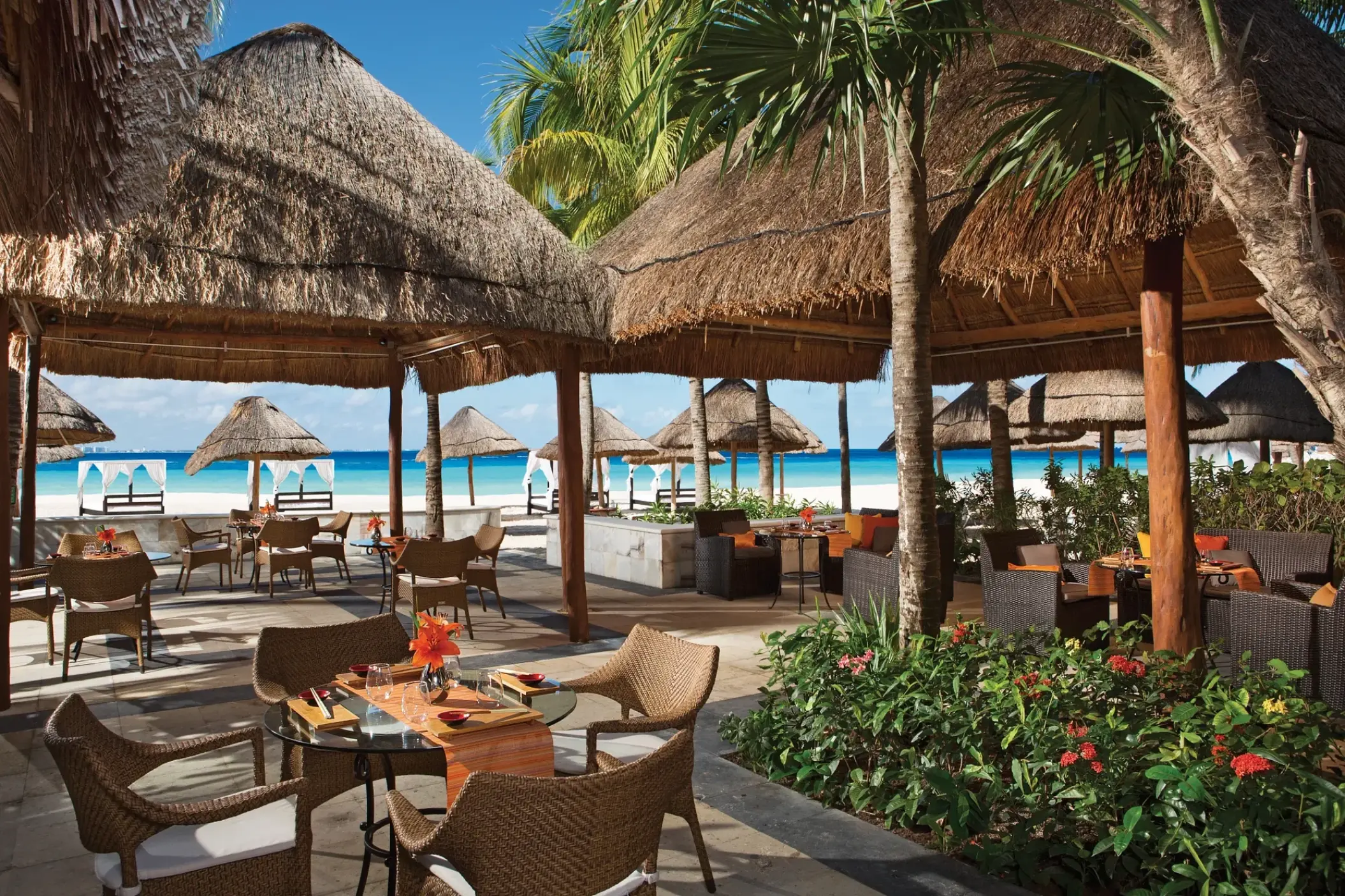 Outdoor thatched roof restaurant at Dreams Sands, Cancun