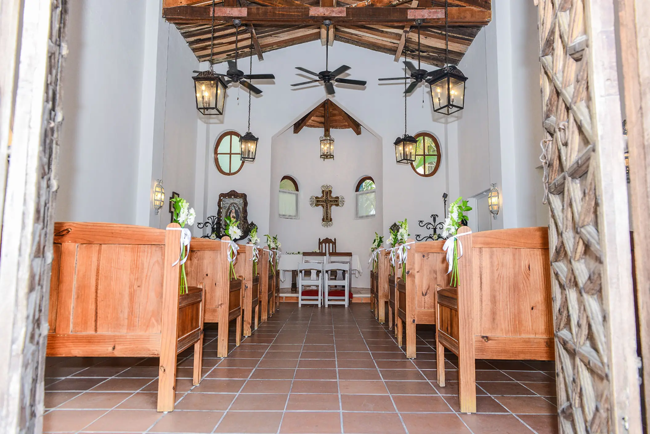 Chapel wedding ceremony venue with wooden pews at Dreams Tulum, Tulum