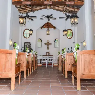 Chapel wedding ceremony venue with wooden pews at Dreams Tulum, Tulum