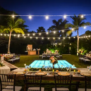 Garden wedding reception with glowing dance floor and string lights at Dreams Tulum, Tulum