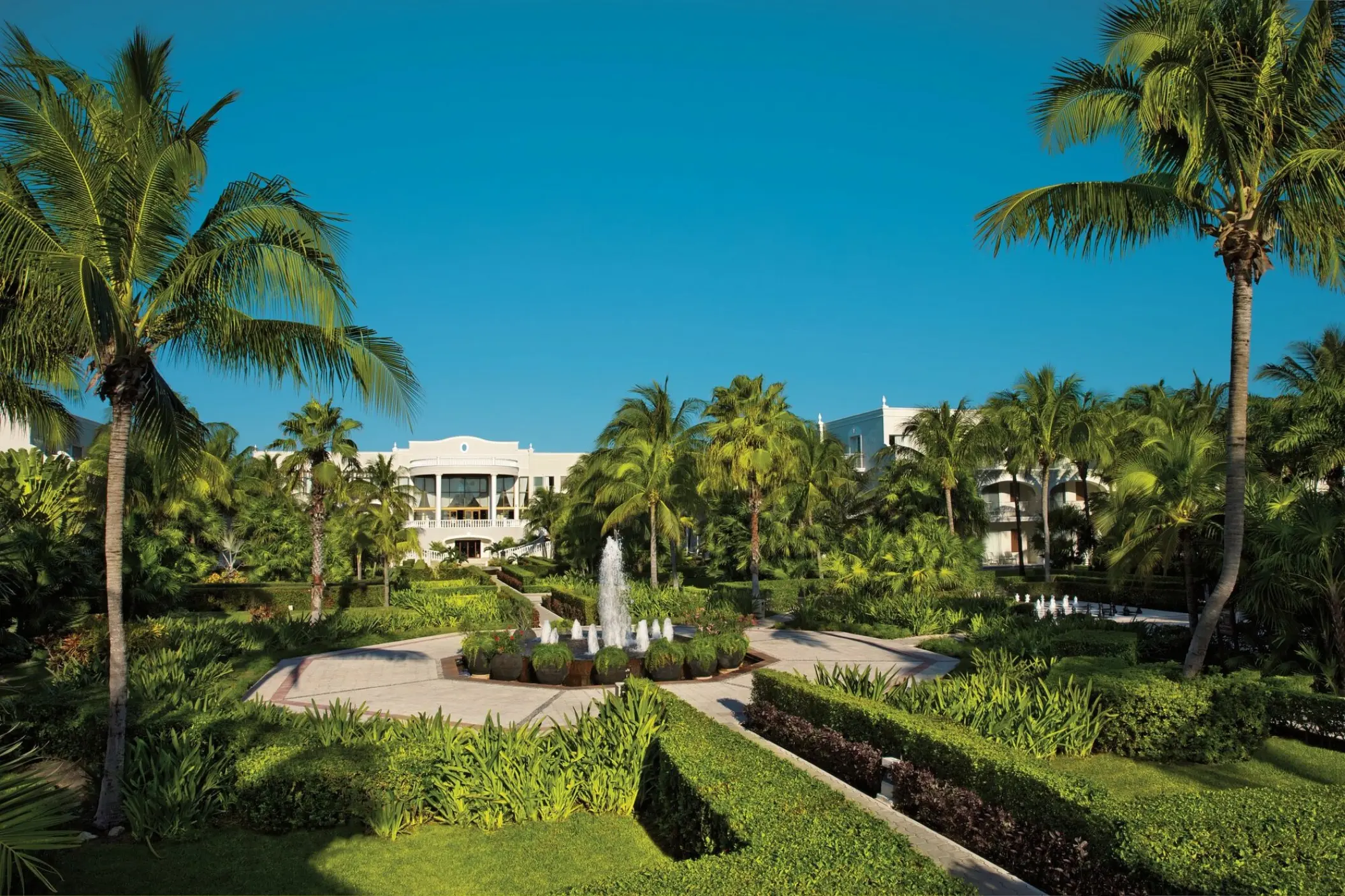 Tropical gardens and central fountain at Dreams Tulum, Tulum