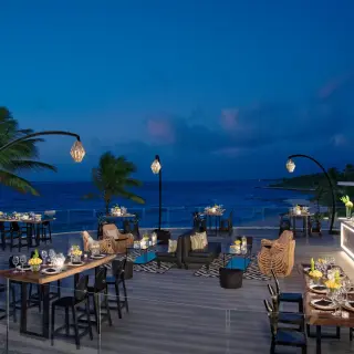 Rooftop terrace wedding reception with ocean views at Dreams Tulum, Tulum
