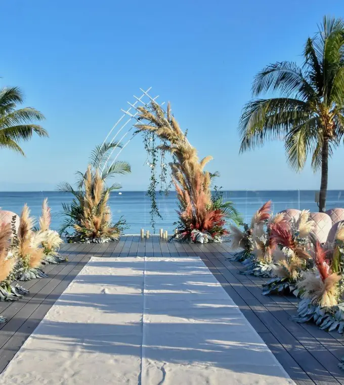 Rooftop wedding ceremony with pampas grass decor at Dreams Tulum, Tulum
