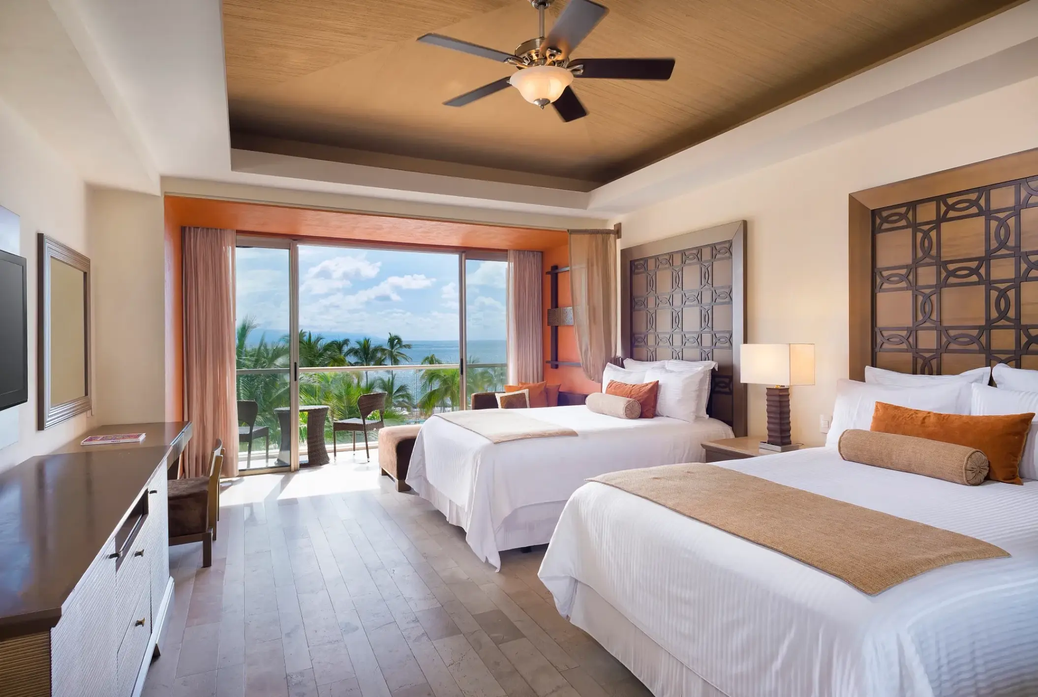 Dreams Vallarta Bay guest suite with two beds and a balcony overlooking the ocean, Puerto Vallarta