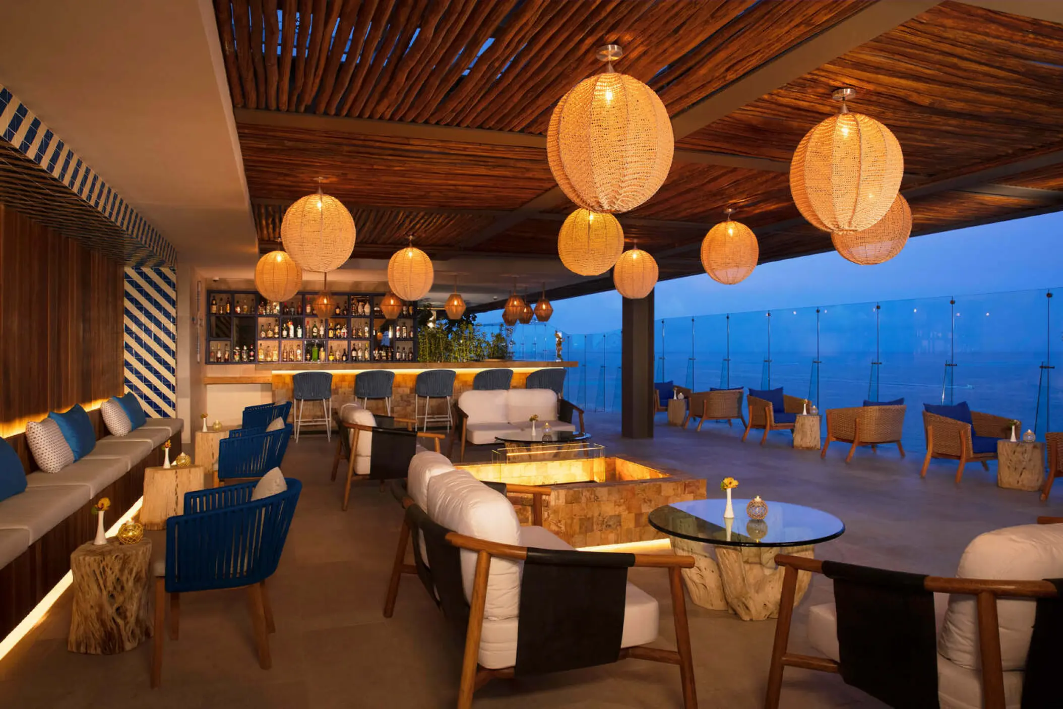 Rooftop lounge with hanging lanterns and ocean views at Dreams Vista Cancun, Cancun