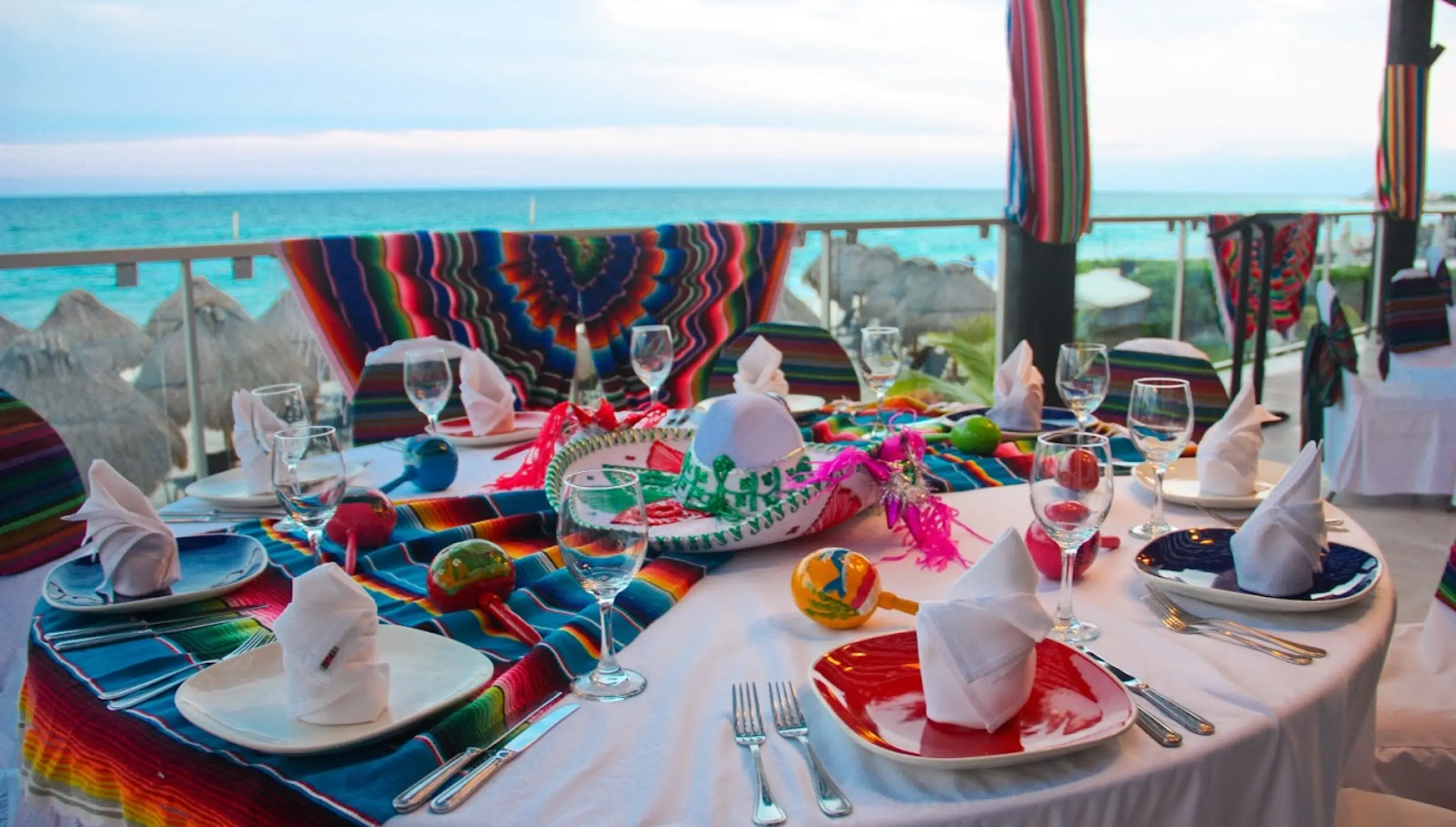 Colorful Mexican themed wedding reception table at Dreams Jade, Riviera Maya