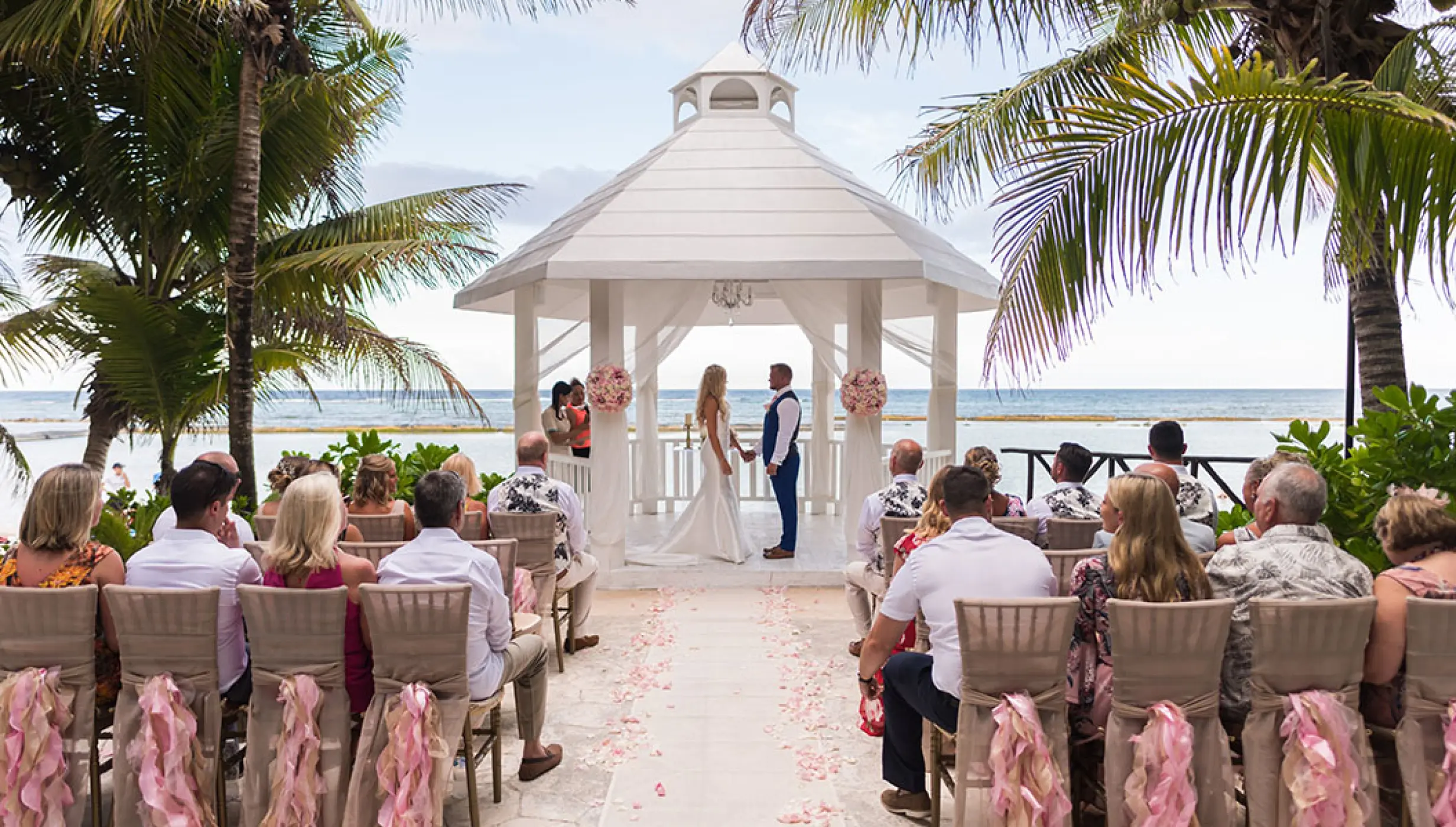 wedding ceremony at white gazebo venue on El dorado Seaside suites