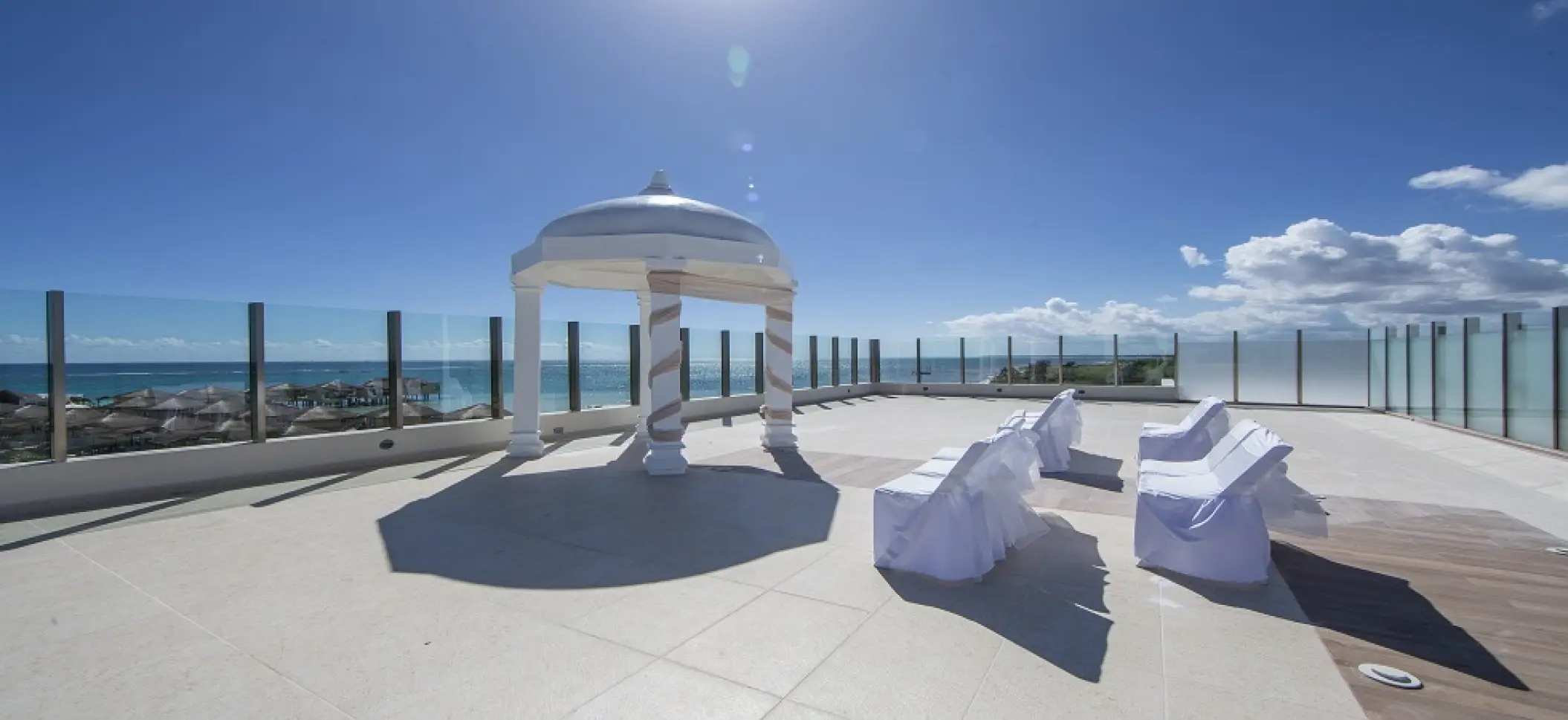 Sky deck wedding ceremony setup with ocean views at El Dorado Maroma, Riviera Maya