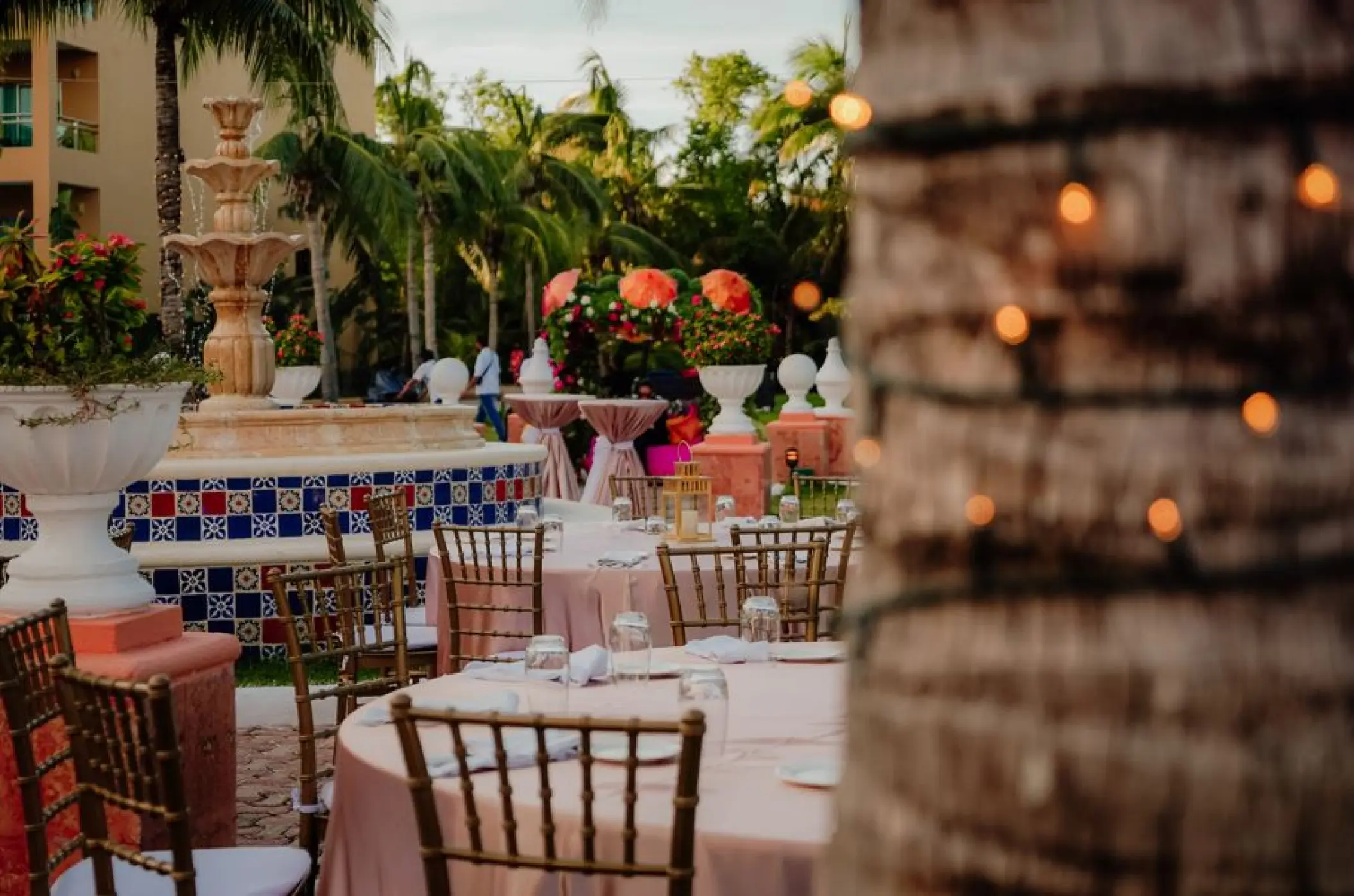Mexican plaza wedding reception with tiled fountain at El Dorado Seaside Palms, Riviera Maya
