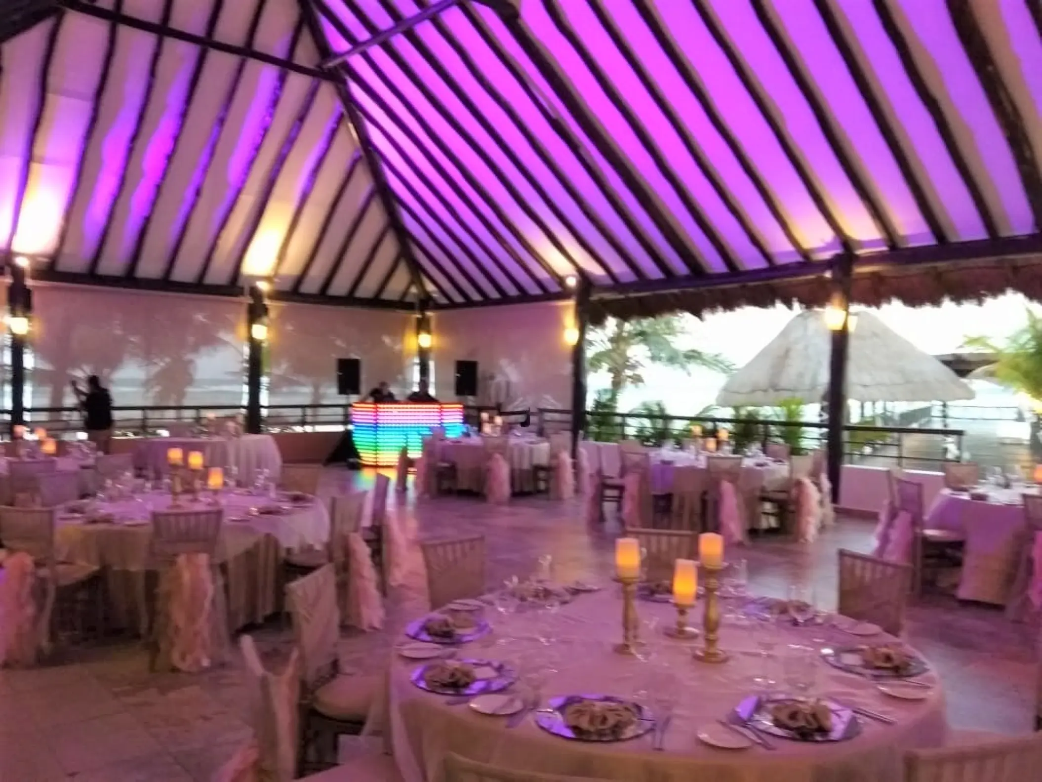 Indoor reception setup with purple lighting at El Dorado Seaside Palms, Riviera Maya