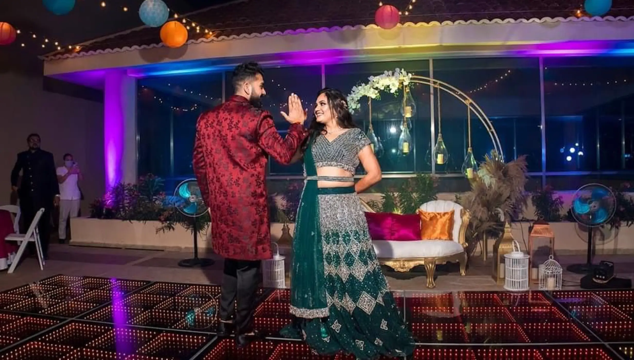 Couple dancing on a light-up floor during a wedding reception at El Dorado Seaside Palms, Riviera Maya