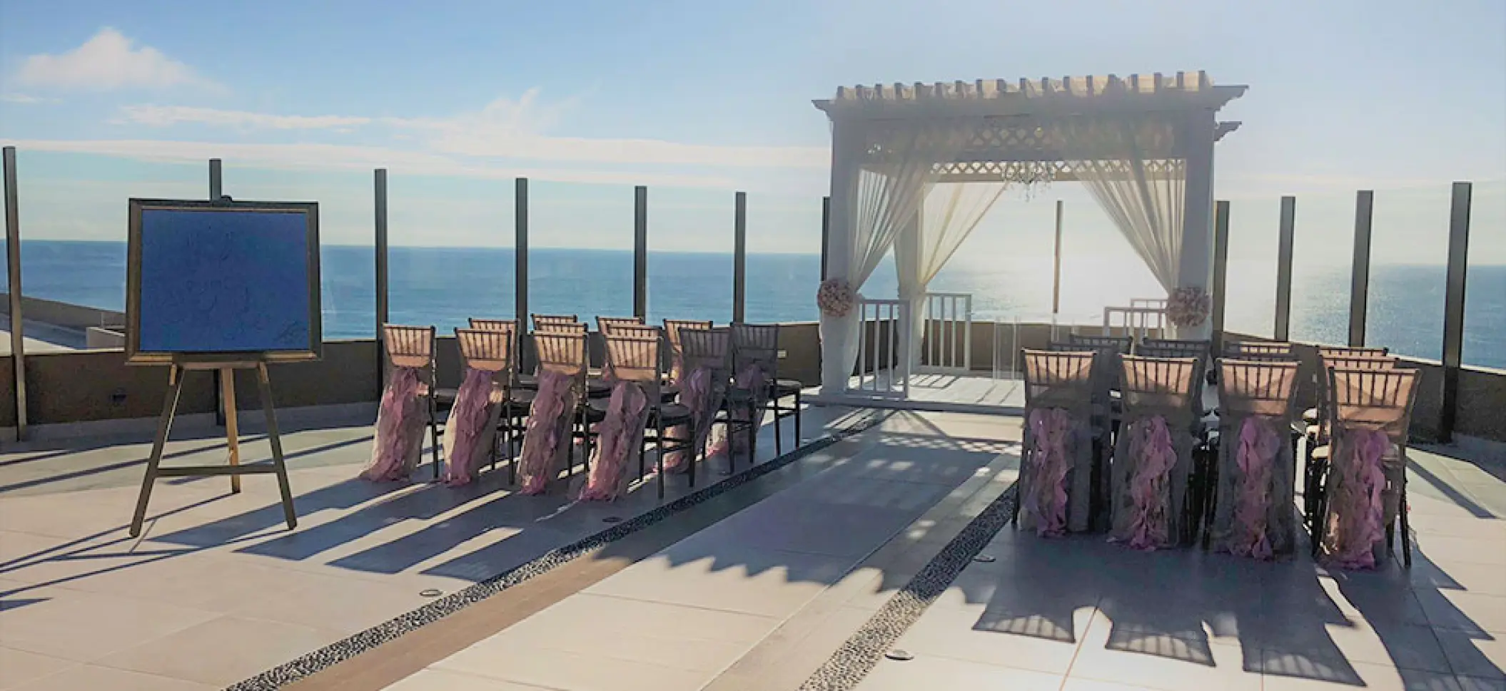 Sky deck wedding ceremony with ocean views at El Dorado Seaside Palms, Riviera Maya