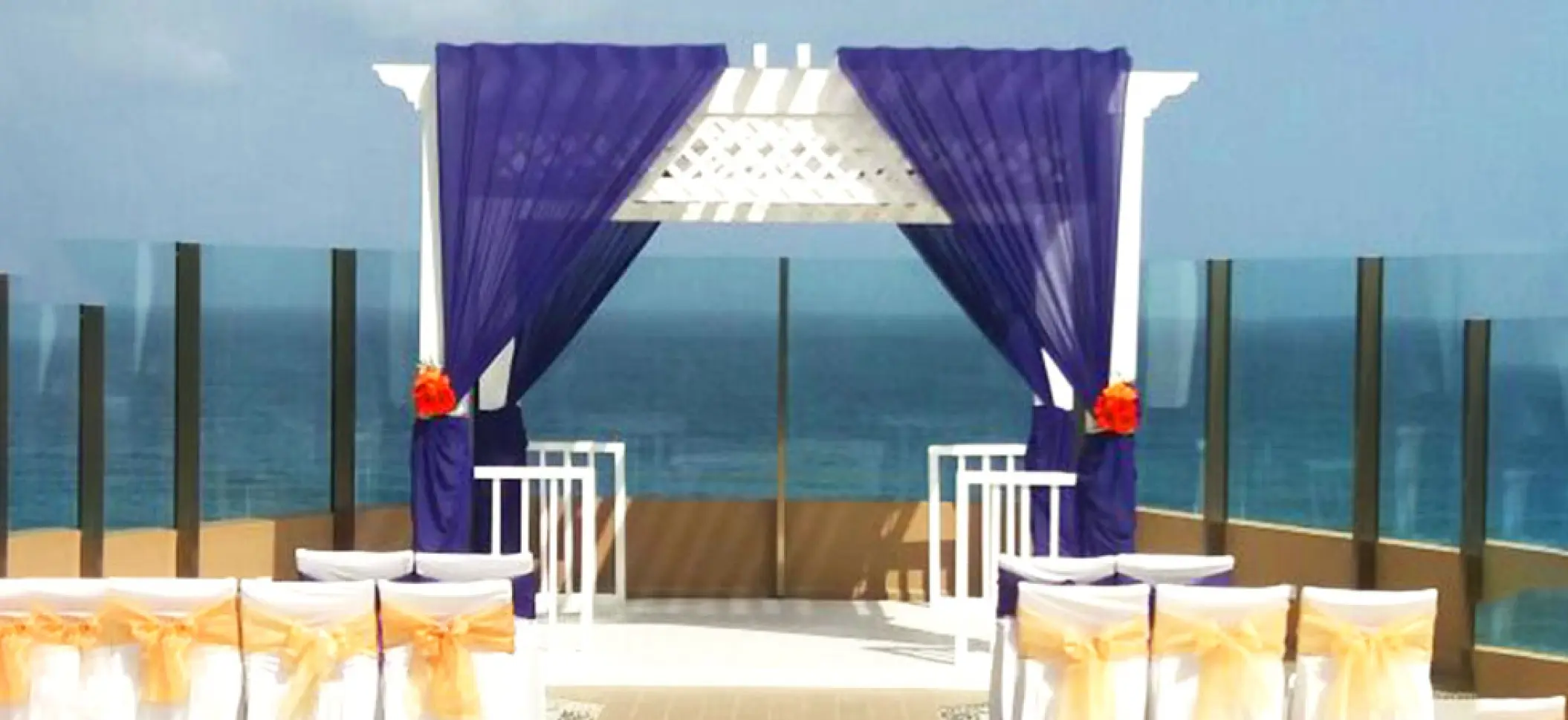 Sky Deck wedding ceremony setup with purple draping at El Dorado Seaside Palms, Riviera Maya