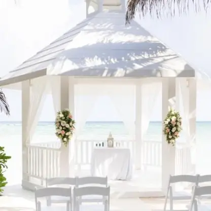 White beachfront gazebo wedding ceremony at El Dorado Seaside Palms, Riviera Maya