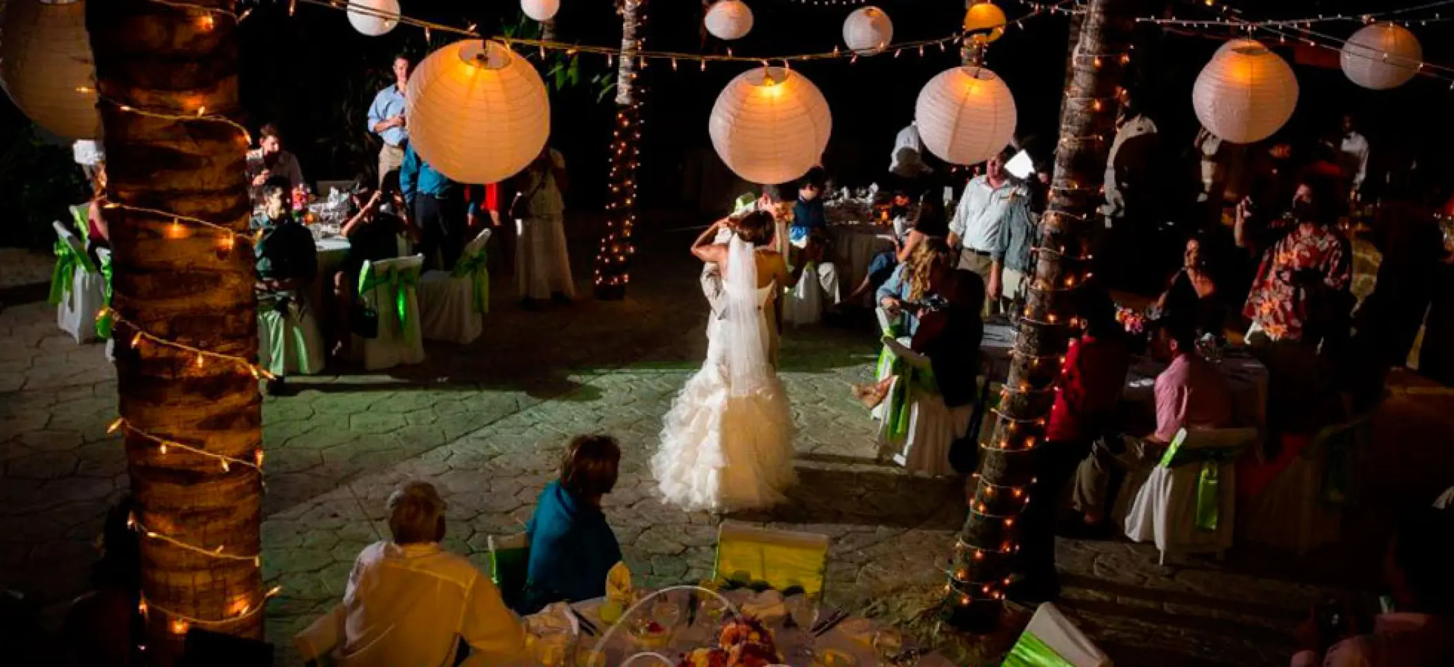 First dance during a nighttime wedding reception at El Dorado Seaside Palms, Riviera Maya