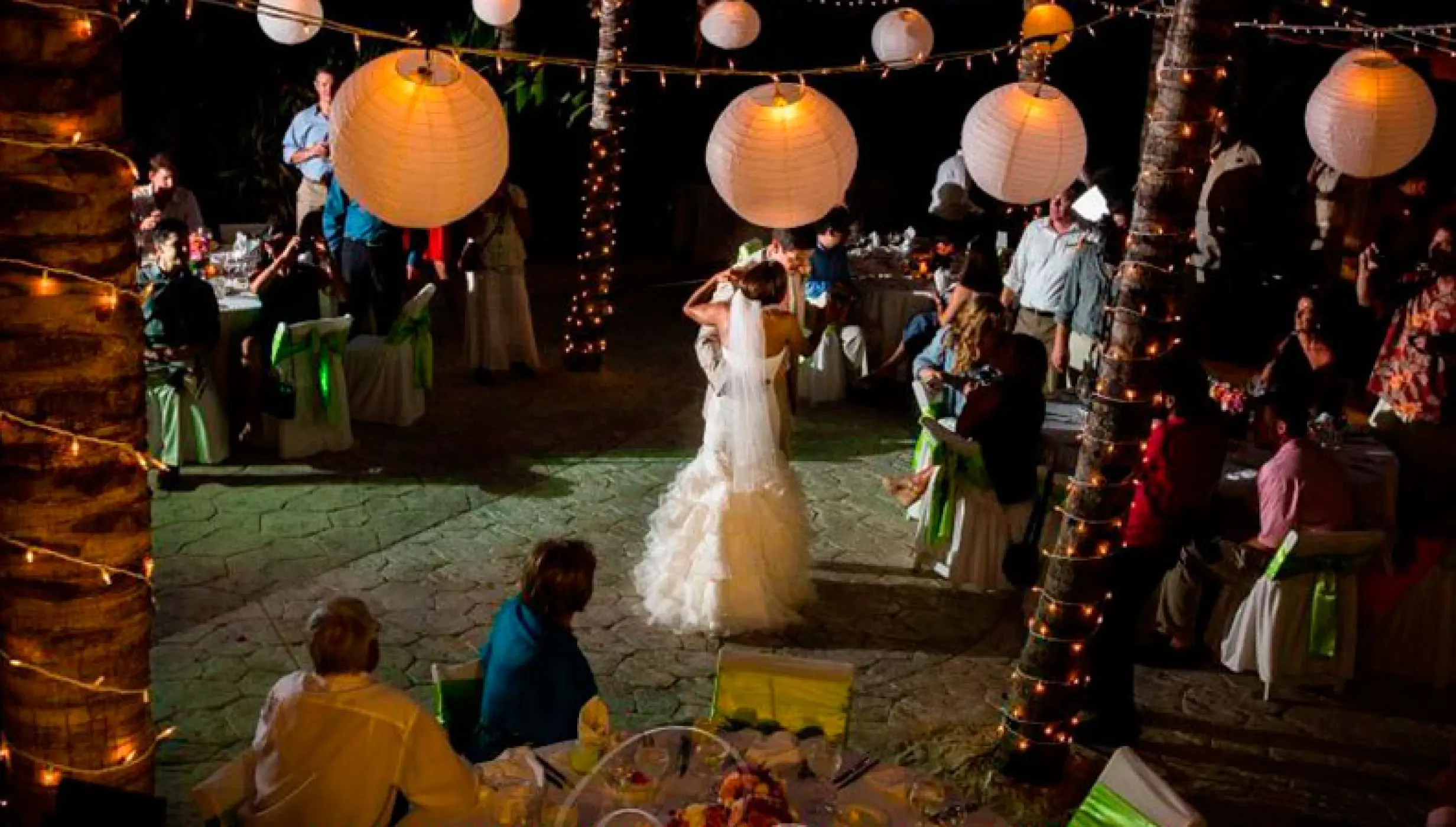 First dance during a nighttime wedding reception at El Dorado Seaside Palms, Riviera Maya