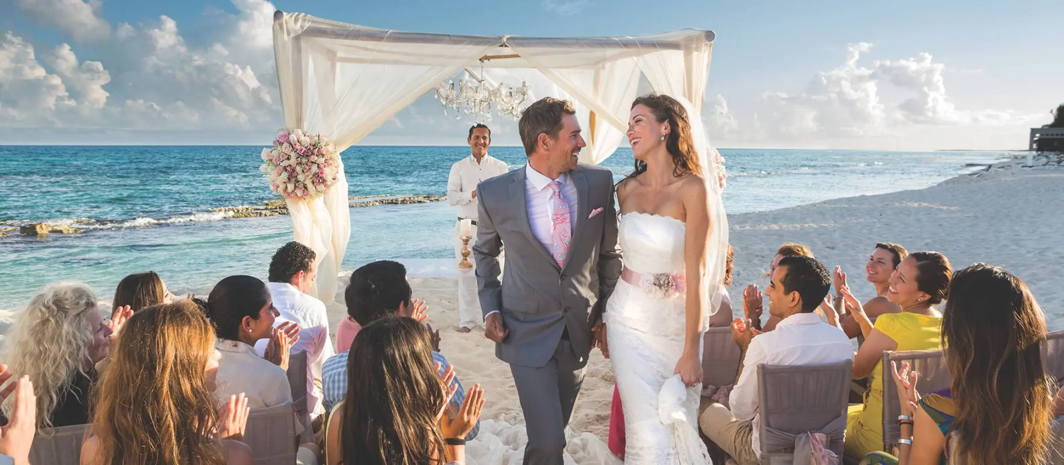 Bride and groom walking down the aisle at a beach ceremony, El Dorado Seaside Palms, Riviera Maya