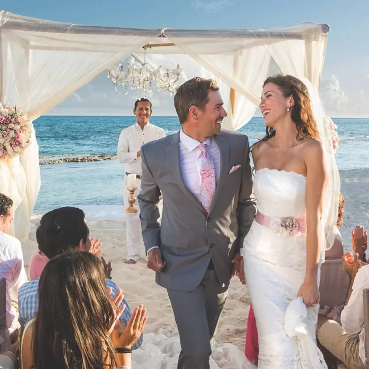 Bride and groom walking down the aisle at a beach ceremony, El Dorado Seaside Palms, Riviera Maya