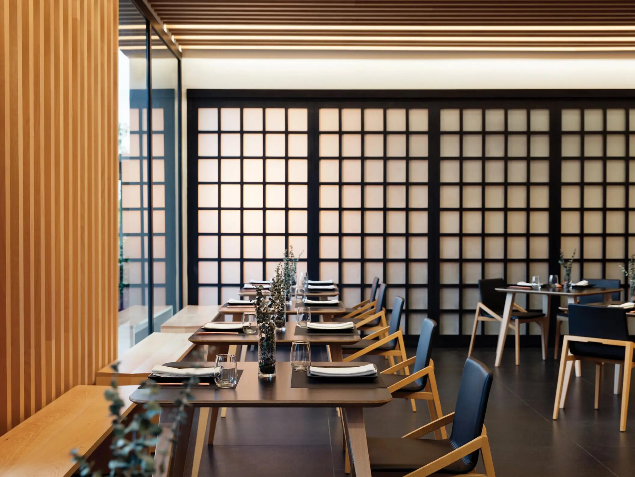 Asian cuisine restaurant with wooden partitions and modern tables at Excellence El Carmen, Punta Cana
