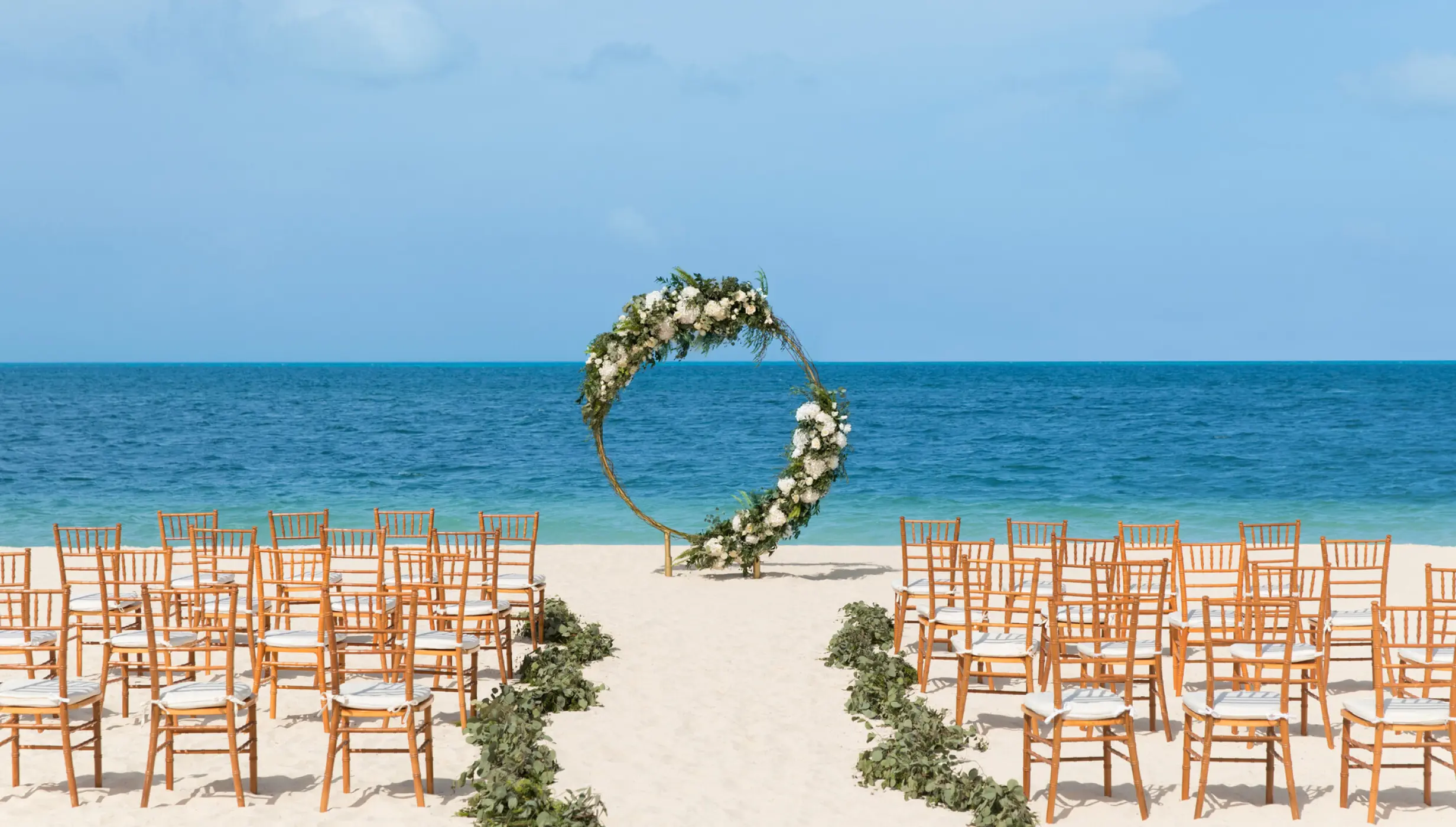 Symbolic ceremony in beach wedding venue at Excellence Playa Mujeres