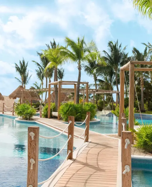 Excellence Playa Mujeres pool bridge walkway