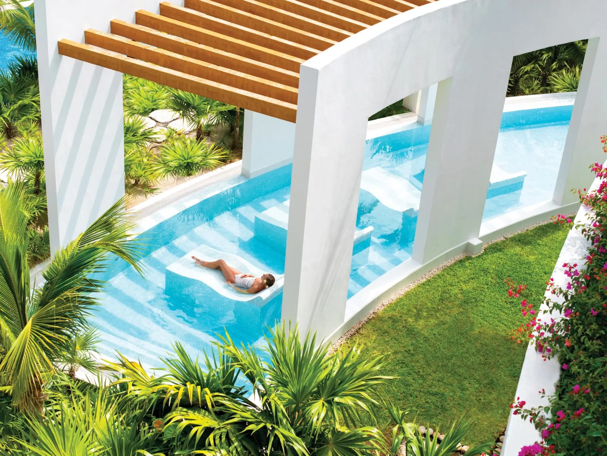 Hydrotherapy spa pool under a wooden pergola at Excellence Playa Mujeres, Cancun