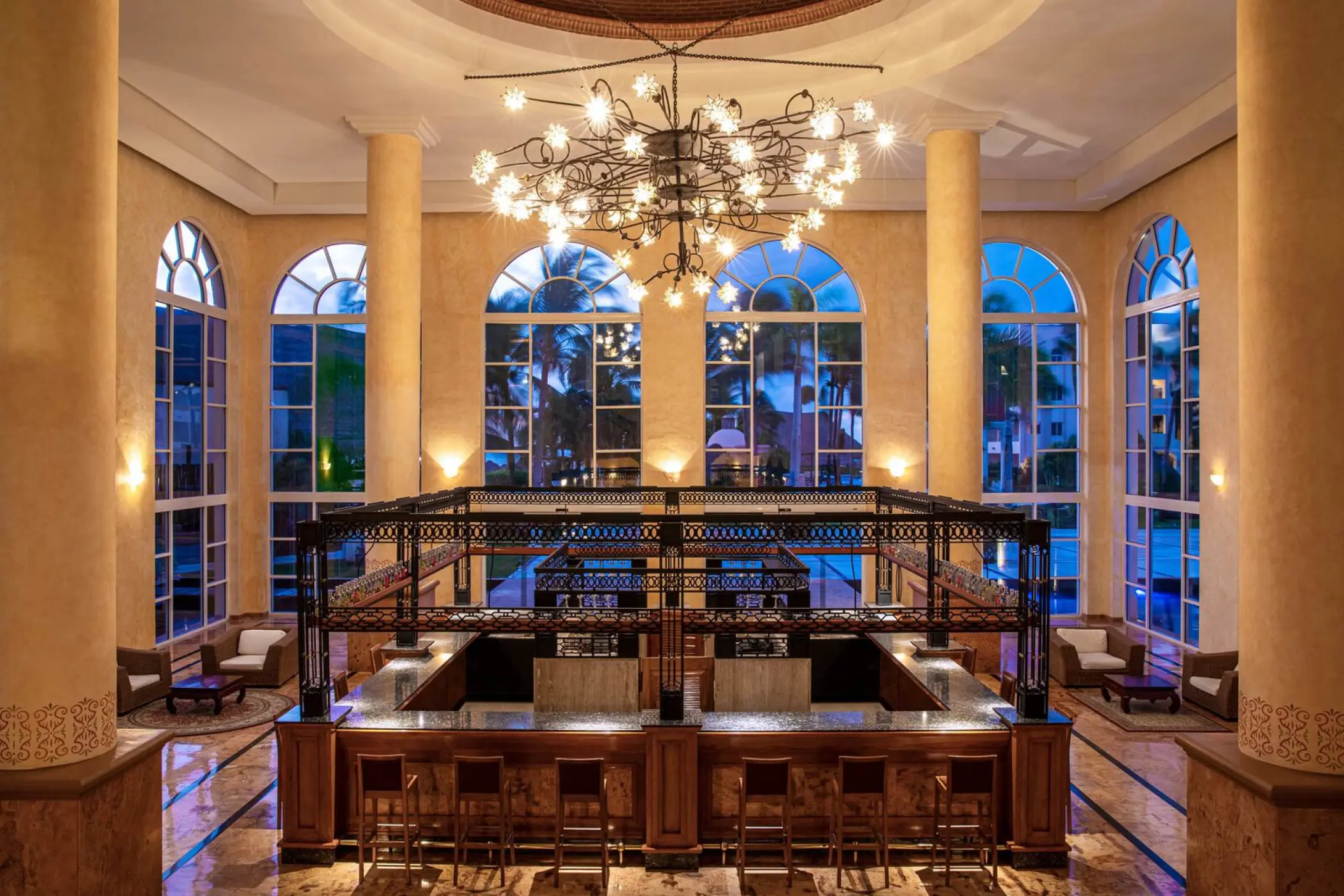 Lobby bar with high ceilings and large arched windows at Excellence Riviera Cancun, Riviera Maya