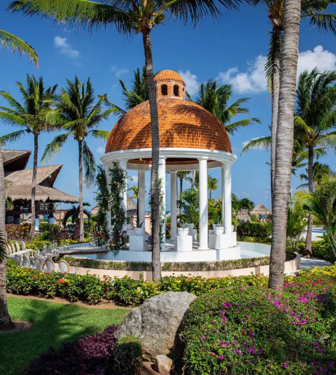 Stone wedding gazebo with a terracotta dome at Excellence Riviera Cancun, Riviera Maya