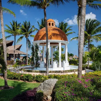 Stone wedding gazebo with a terracotta dome at Excellence Riviera Cancun, Riviera Maya
