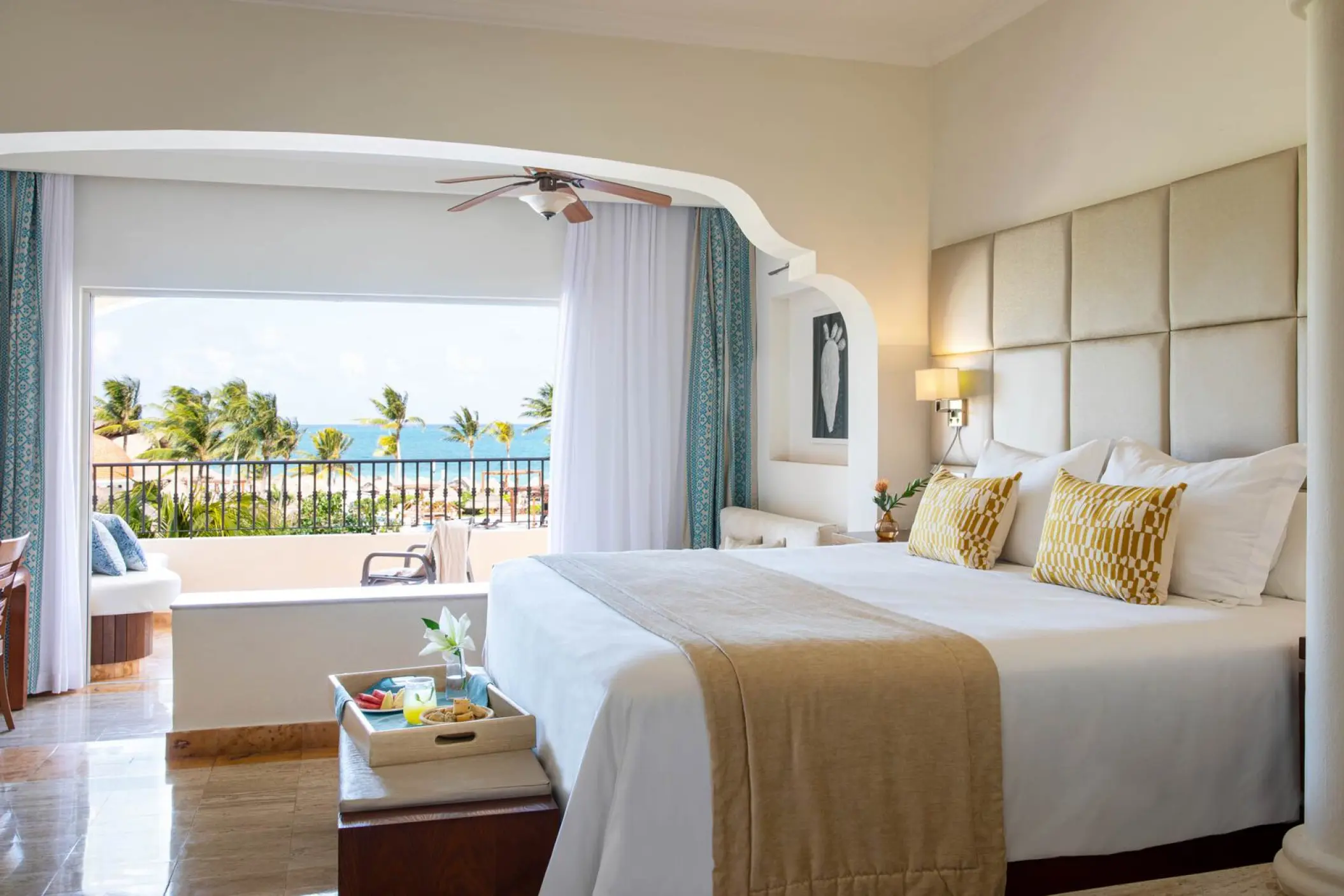 Ocean view suite with a private balcony and breakfast tray at Excellence Riviera Cancun, Riviera Maya