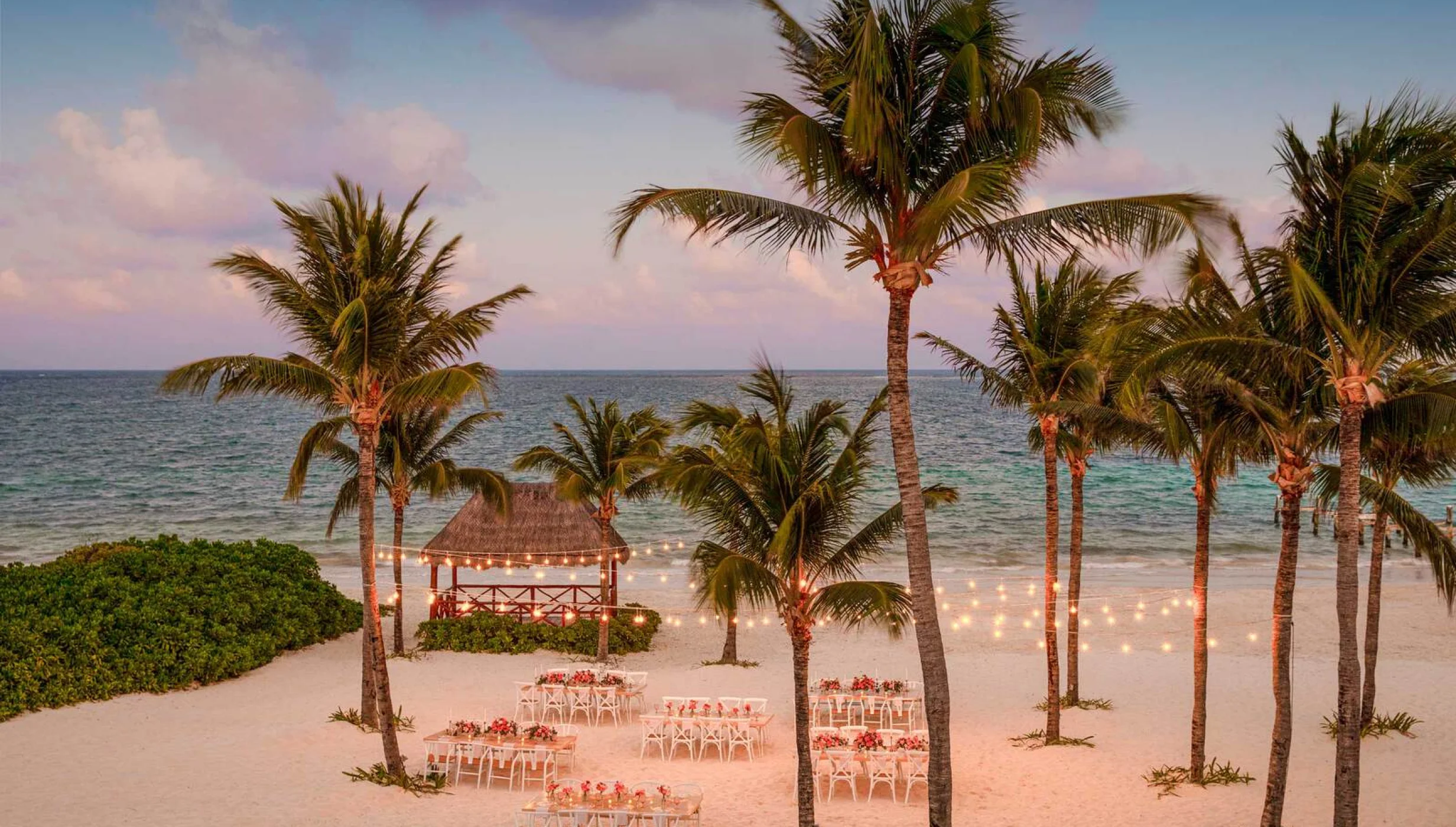 beach wedding reception with seating at Excellence Riviera Cancun