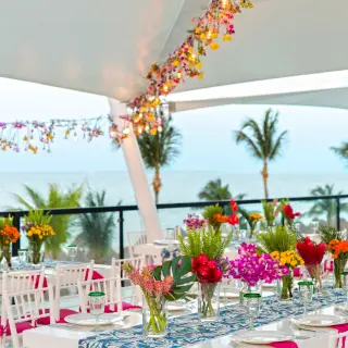 Outdoor wedding reception setup with ocean views at Finest Playa Mujeres, Cancun