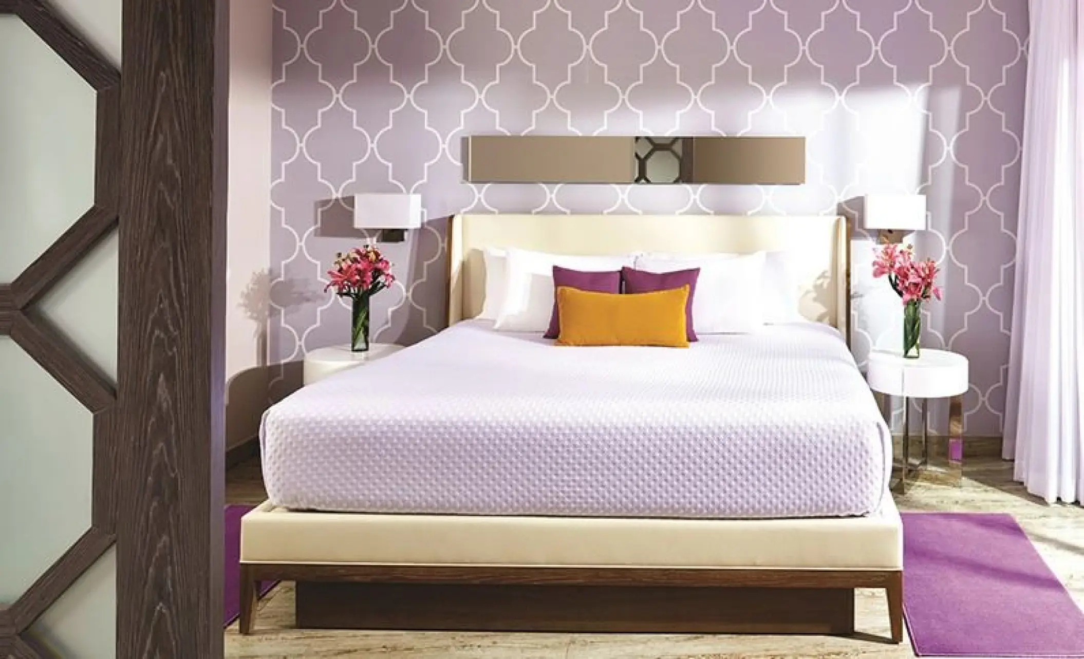 Modern bedroom with purple patterned wallpaper and floral accents at The Fives Beach Hotel, Playa Del Carmen