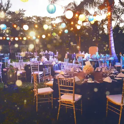 Evening wedding reception at The Fives Beach Hotel, Playa Del Carmen with lantern lights over garden tables