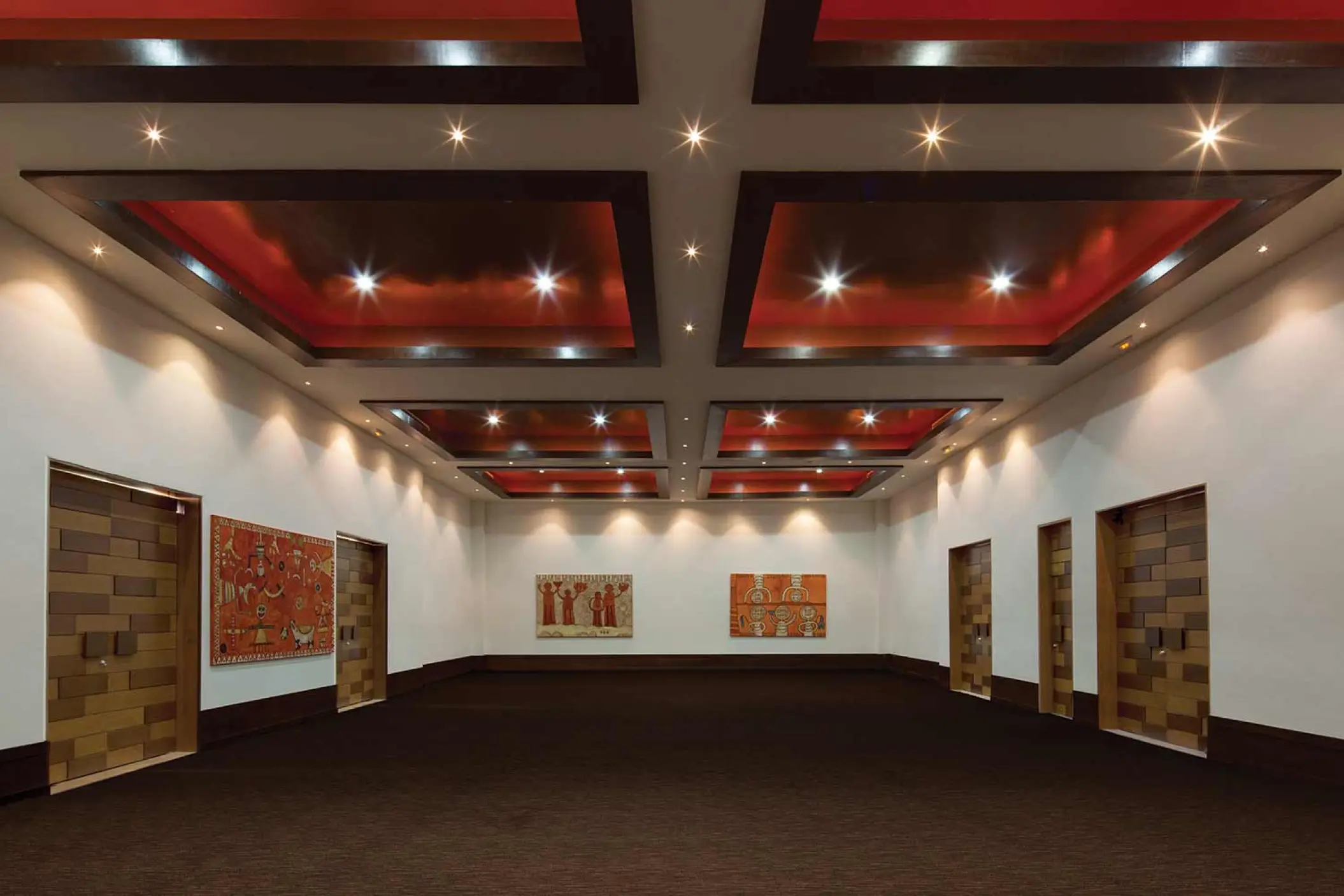 Modern indoor salon with tray ceilings at The Fives Beach Hotel, Playa Del Carmen