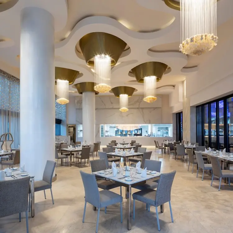 Blanca Blue restaurant with glass chandeliers and modern decor at Garza Blanca Los Cabos, Cabo San Lucas