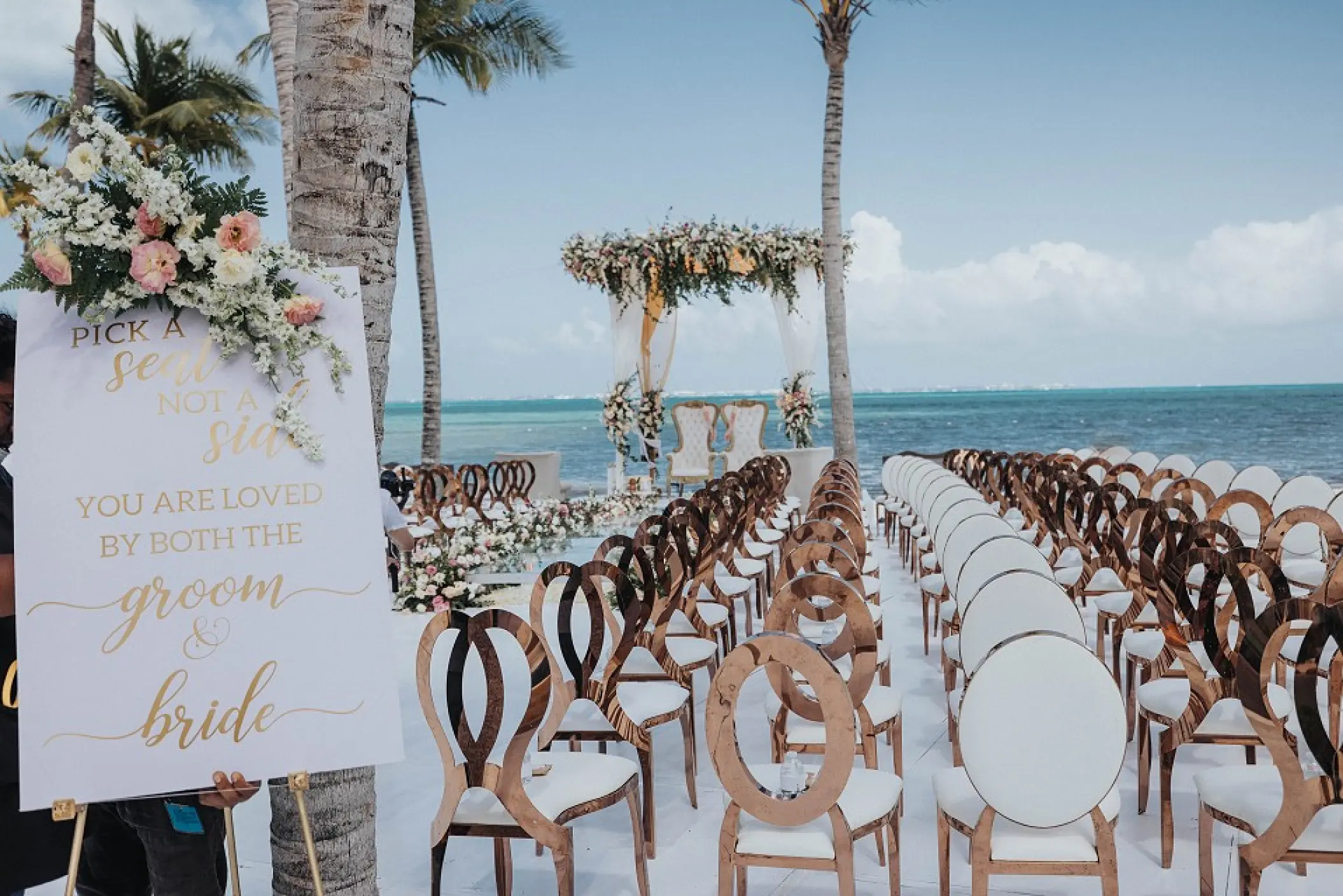 Beachfront wedding ceremony setup at Garza Blanca Cancun, Cancun