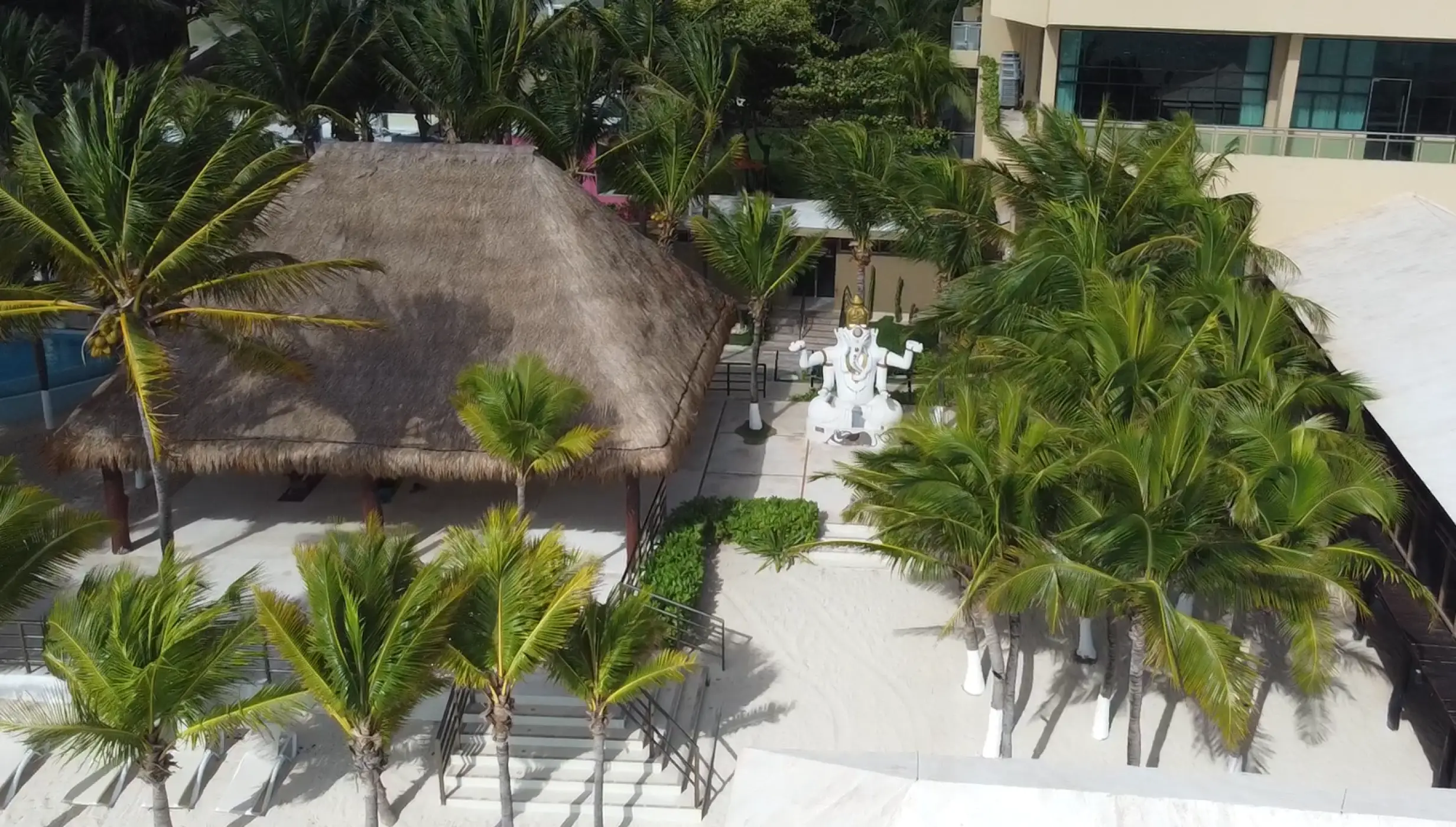 beach reception venue with palm trees at Generations Riviera Maya resort